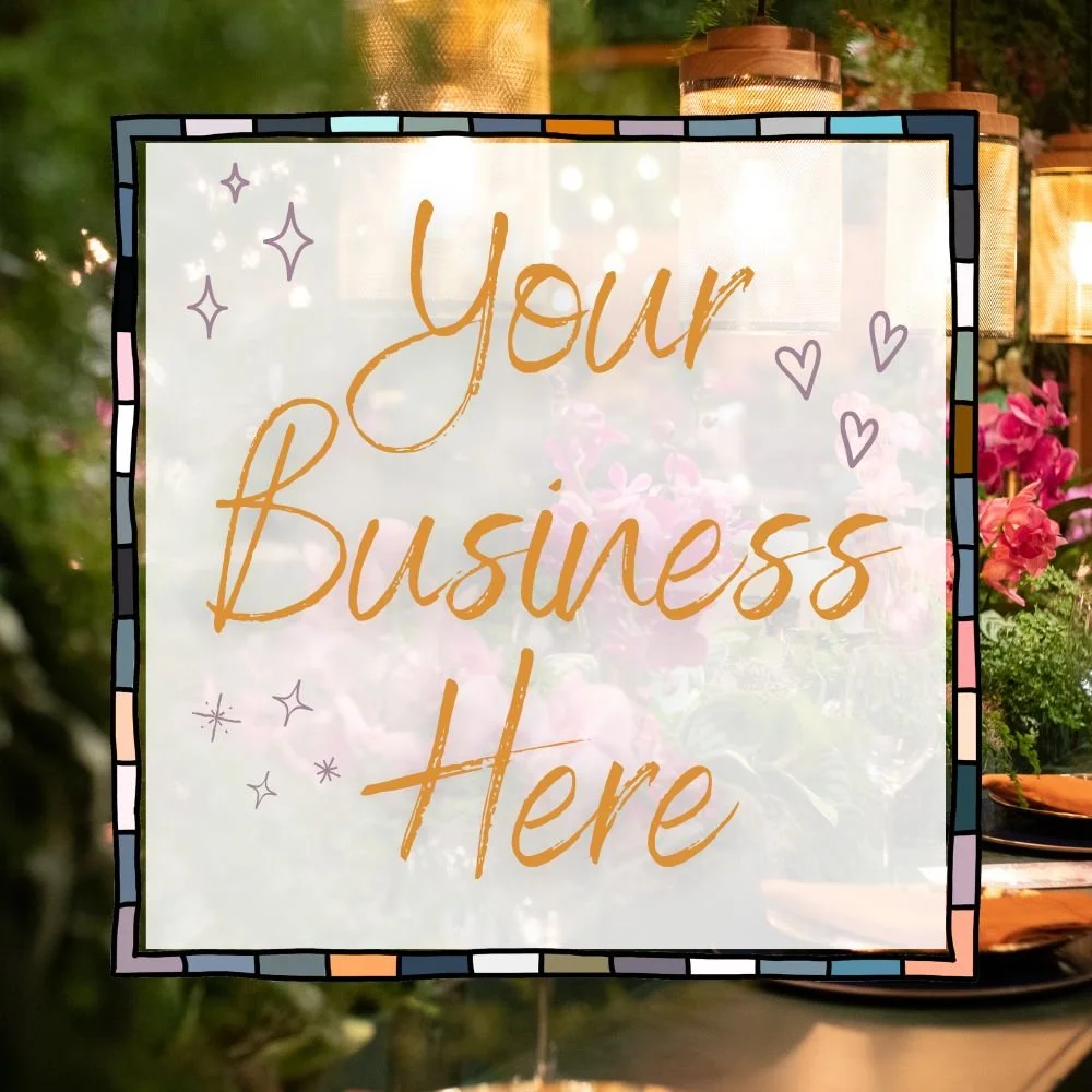 A decorative sign with the text "Your Business Here" in orange, surrounded by a colorful mosaic border, placed in an outdoor setting with flowers and greenery.