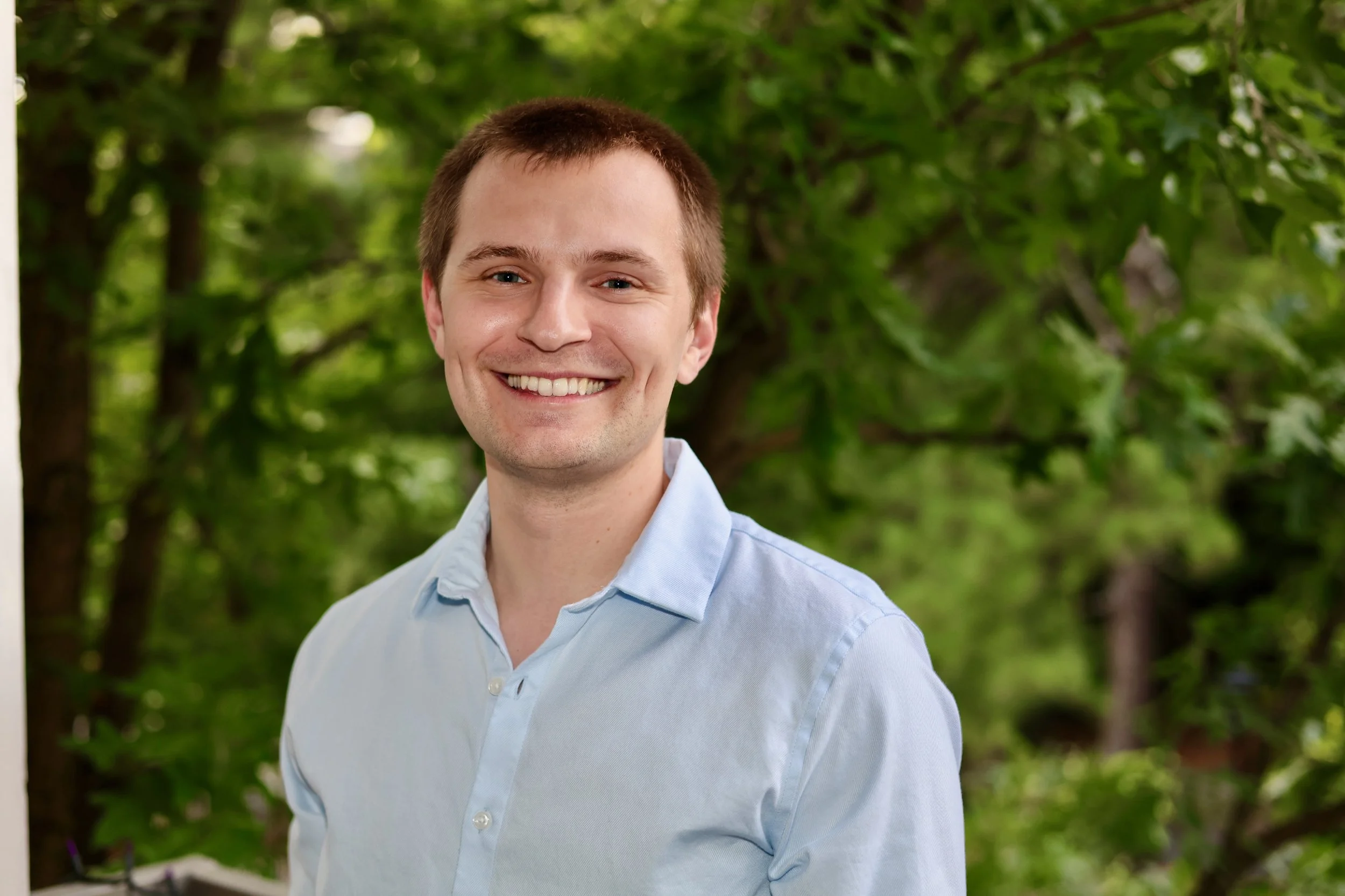Professional headshot of a man in a blue shirt, Metro Atlanta