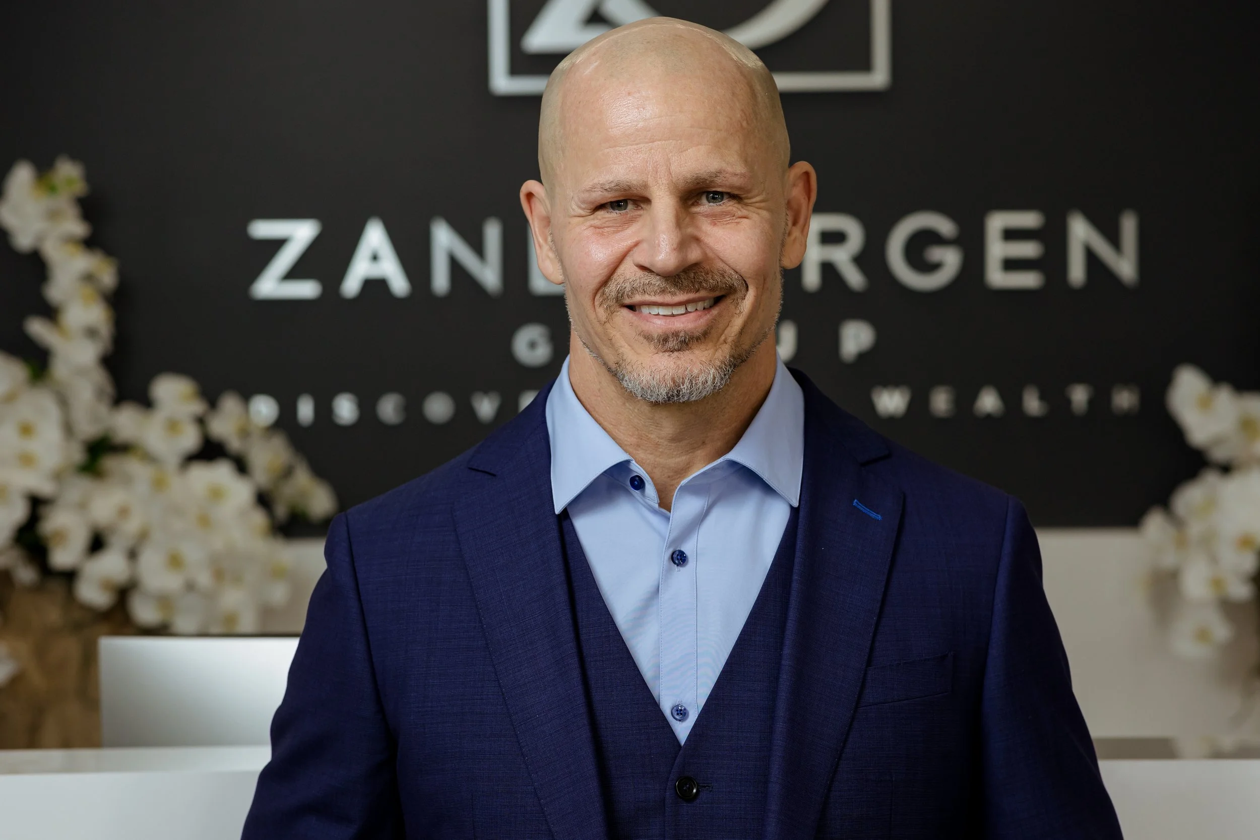 Tony Kakuk CFP® wealth advisor Orange County smiling in front of Zandbergen Group office