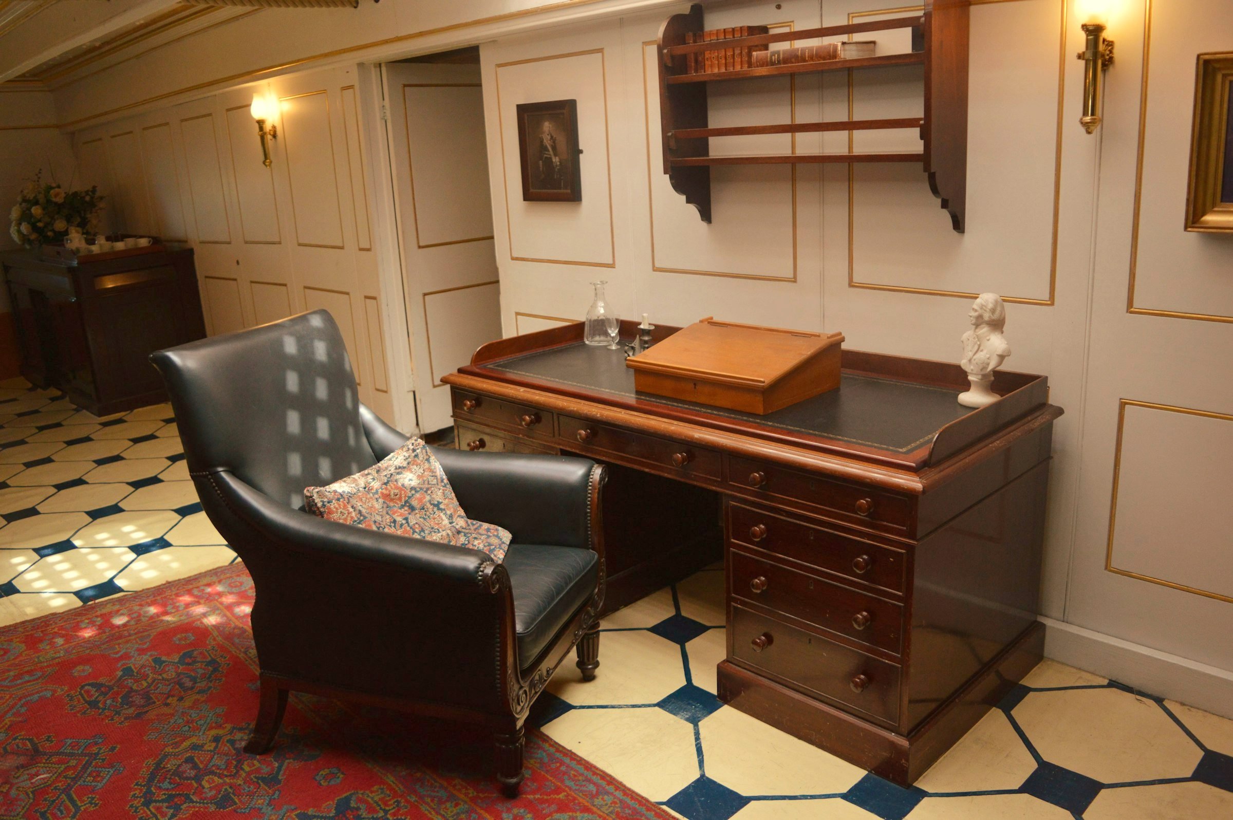 A classic study with a leather armchair and a writing desk