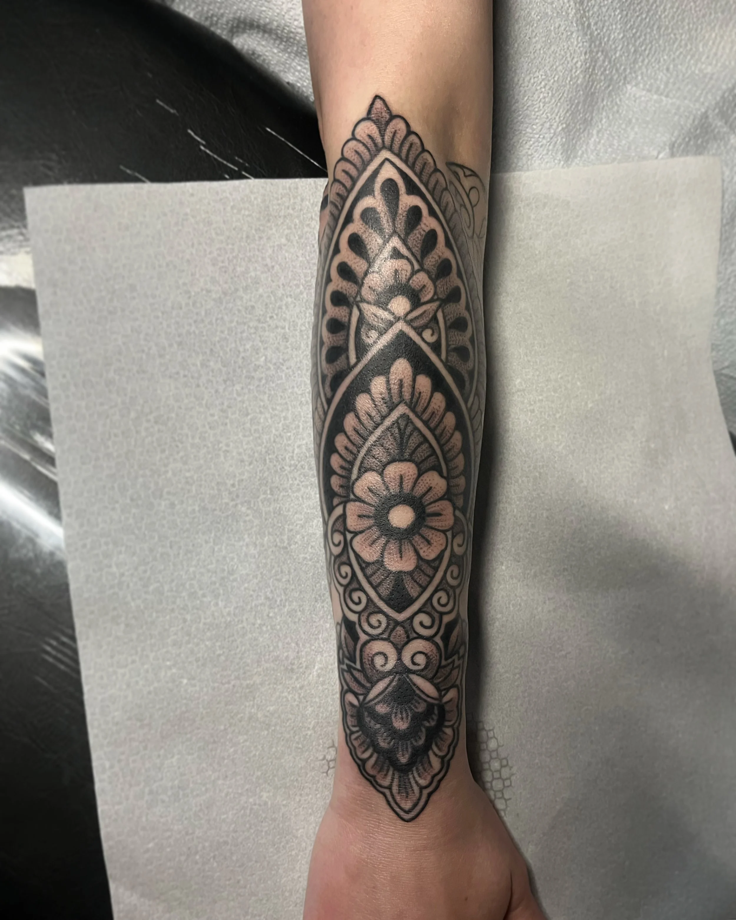 Black and gray feminine arm tattoo by Jesse Smith tattoo artist serving Pittsburgh, PA.