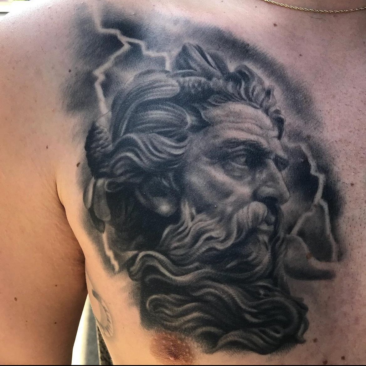 Black and gray chest tattoo of Zeus by Jesse Smith in Pittsburgh, PA.