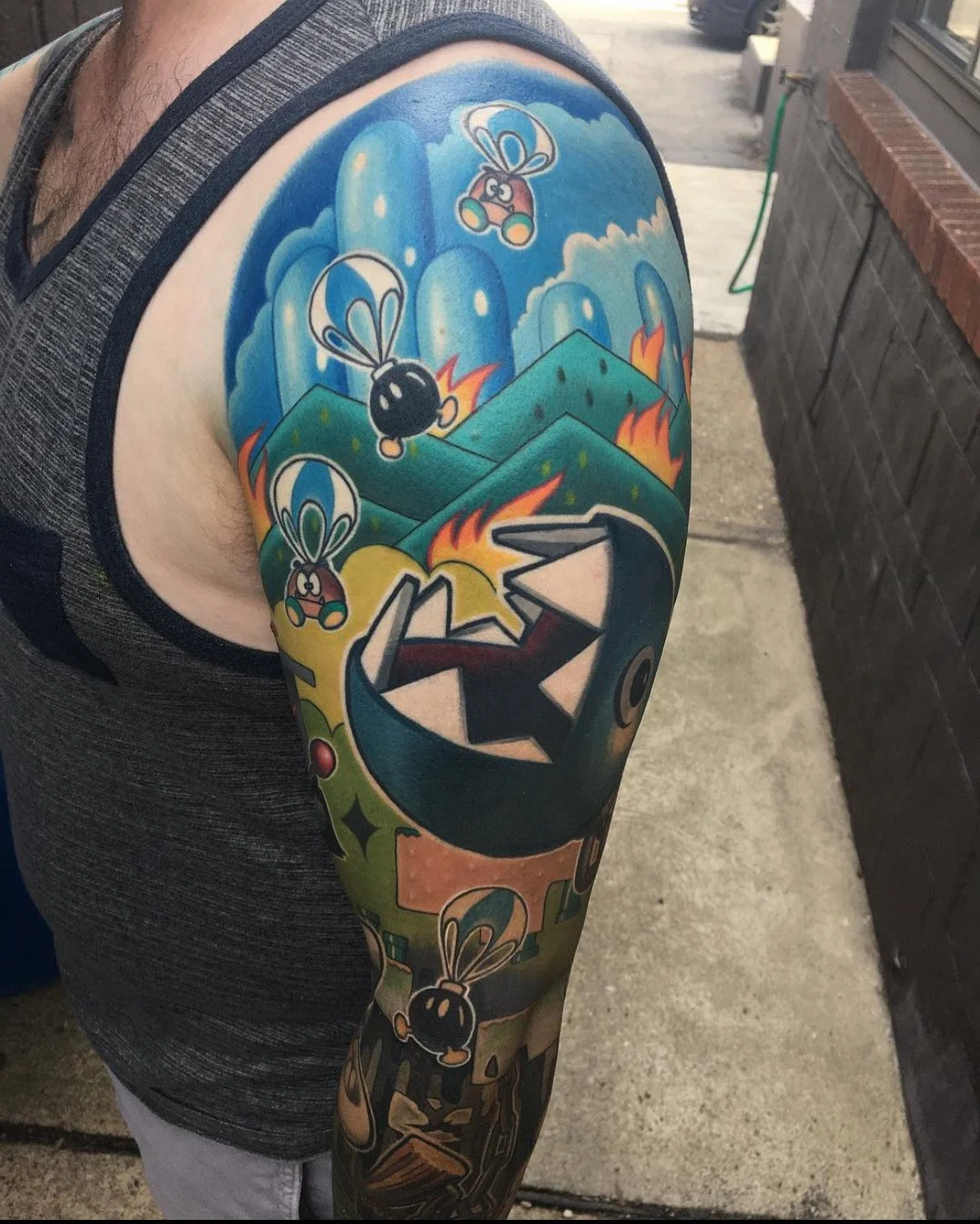 Colorful Mario Brothers tattoo sleeve on a person's arm by Jesse Smith in Pittsburgh, PA