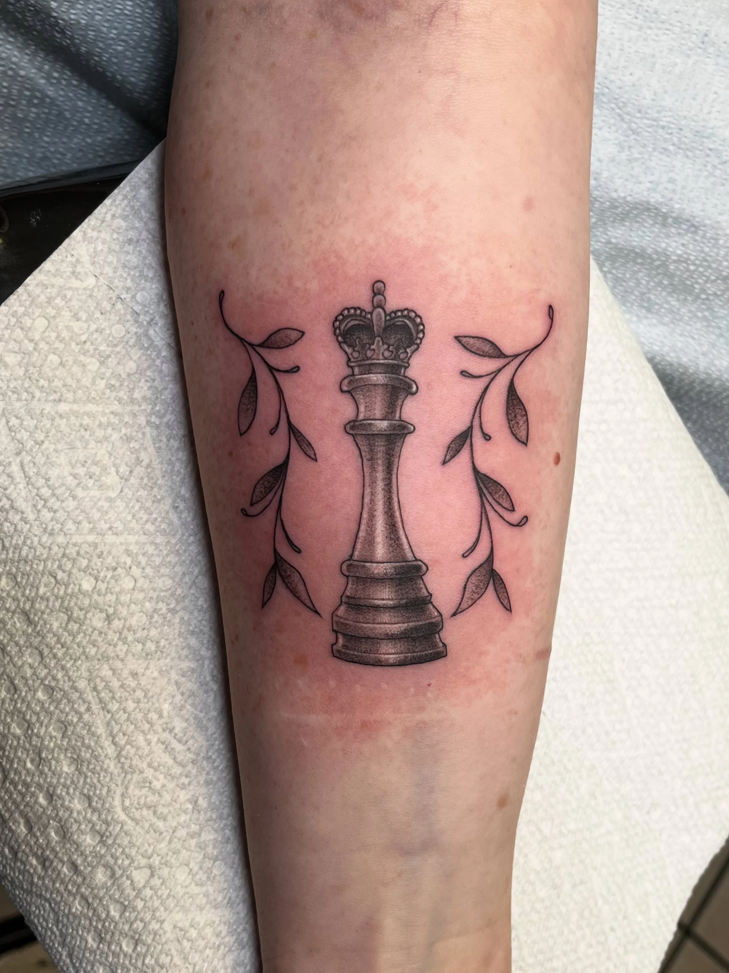 Black and gray chess tattoo by Jesse Smith in Bethel Park, PA