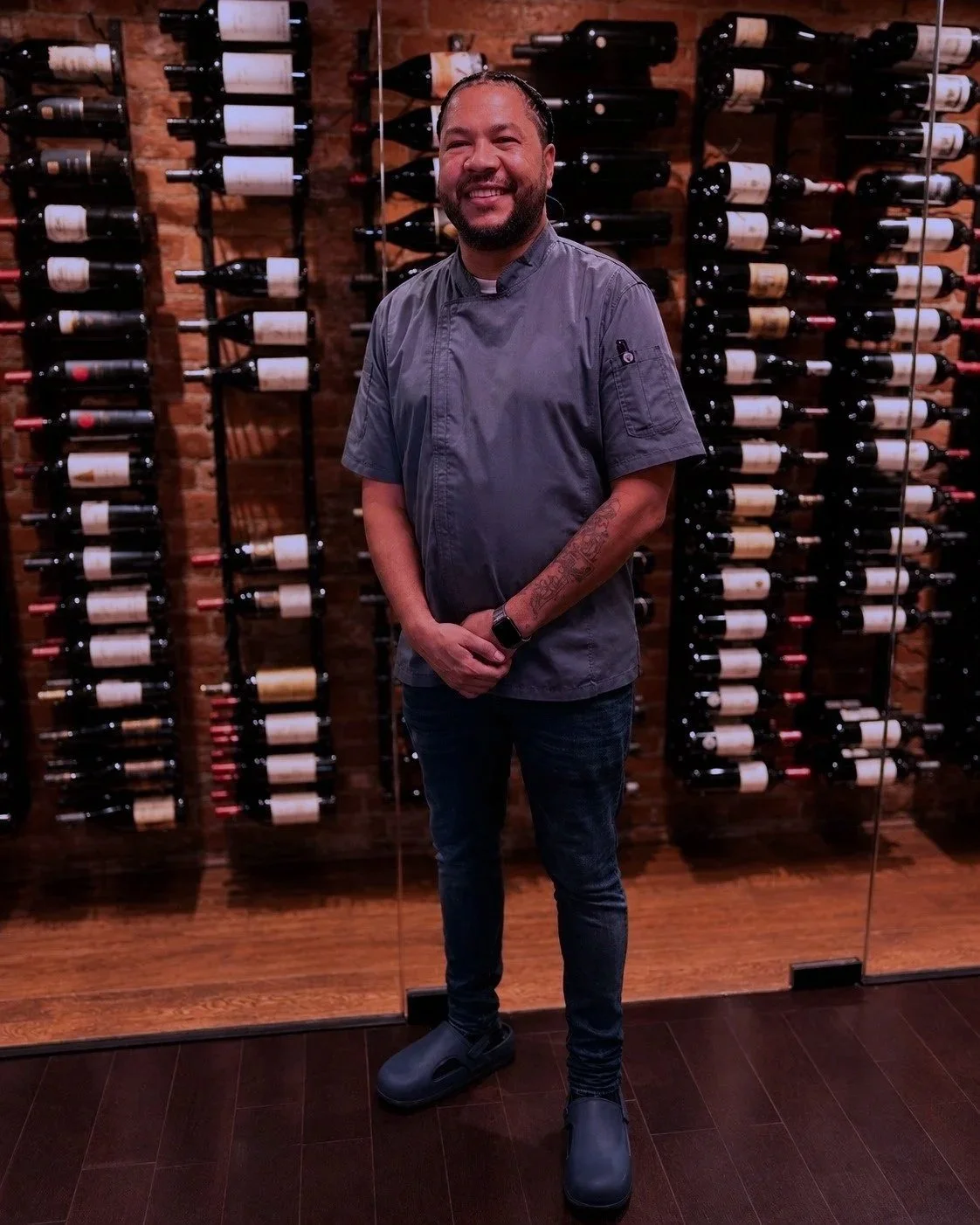 Smiling%252BChef%252Bin%252Ba%252BCozy%252BWine%252BCellar.jpg