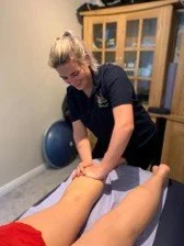 Harriet performing a sports massage