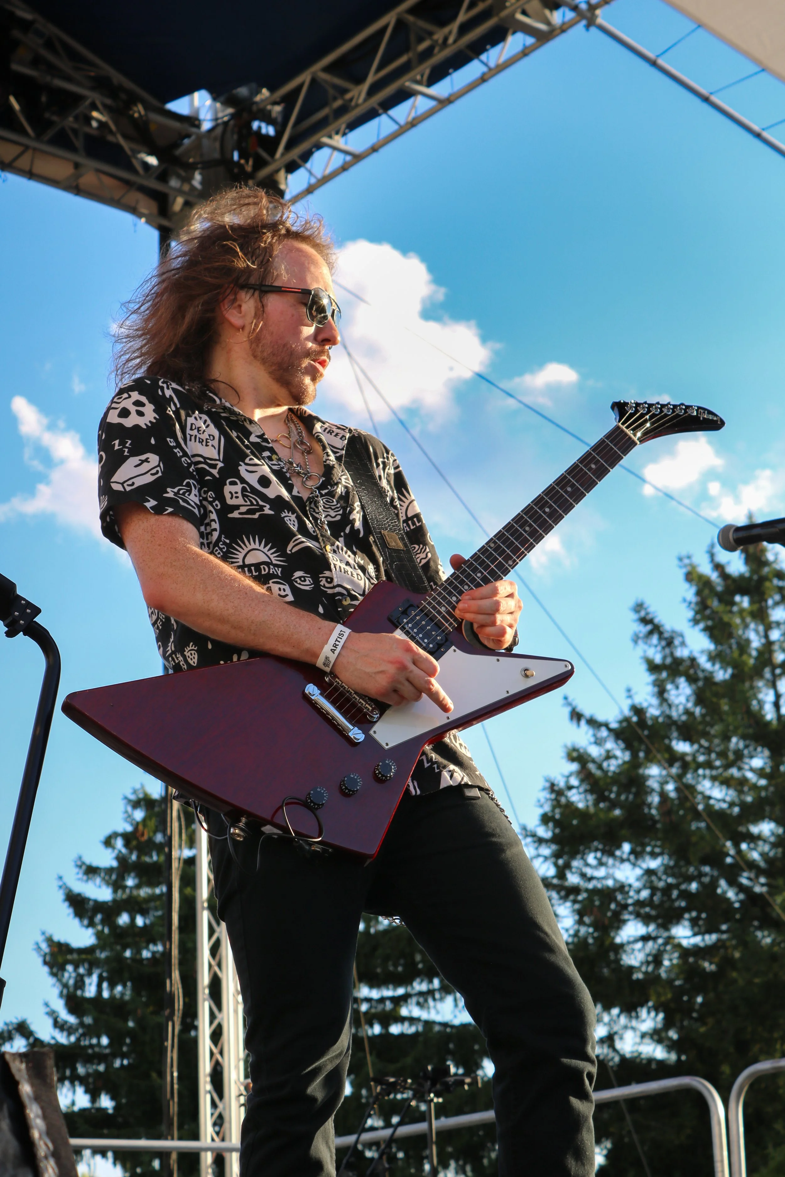 Nick of The Gypsies plays guitar for Lindsay Jordan Music while sticking out his middle finger