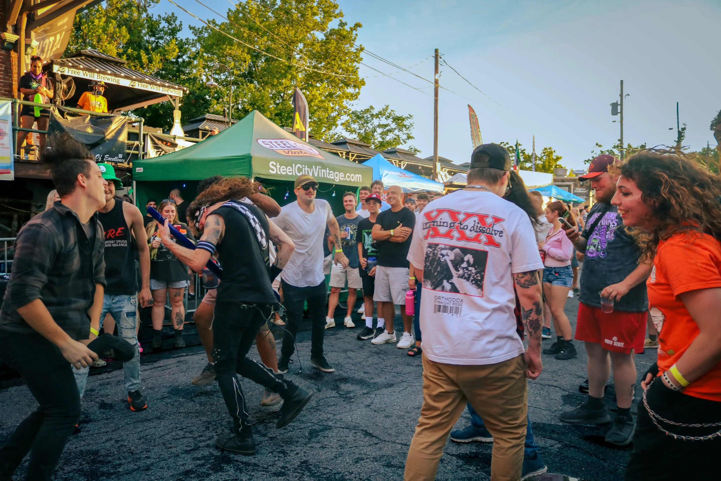 Tyler, guitarist for Kvrma, performs in the mosh pit