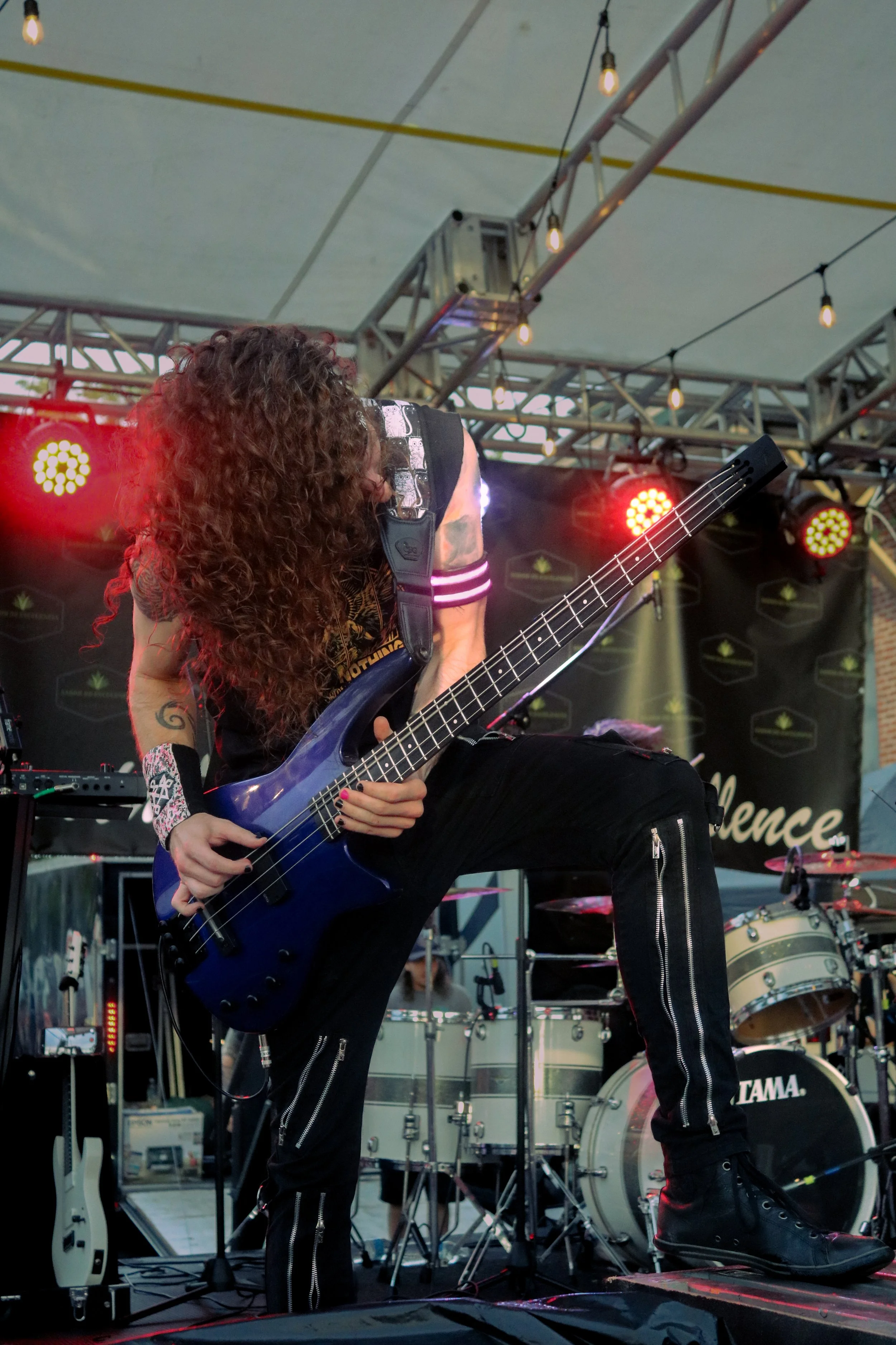 Tyler of Kvrma shreds on guitar during a live performance
