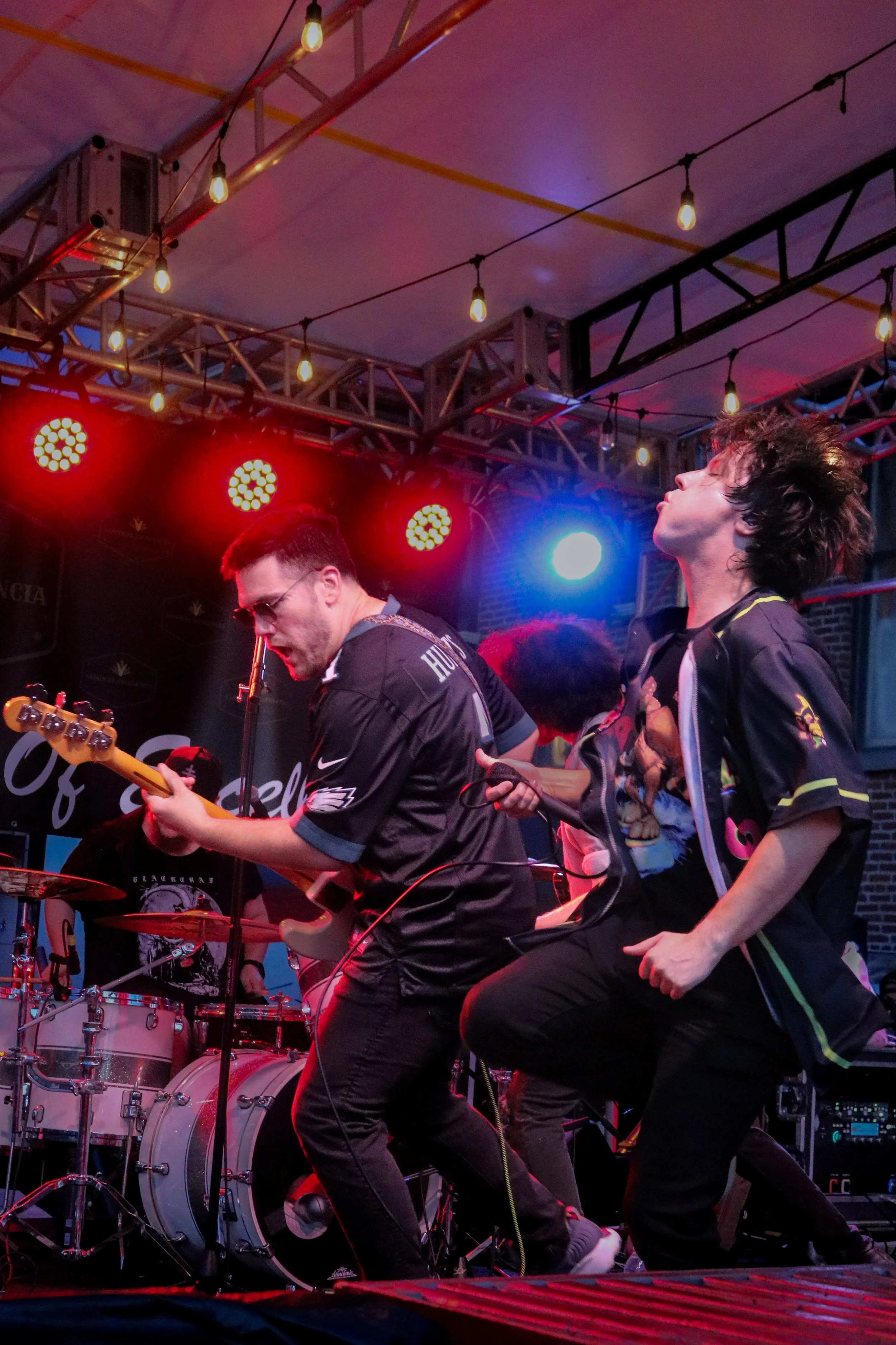 Crooked Ways perform live on stage, with the band members playing their instruments