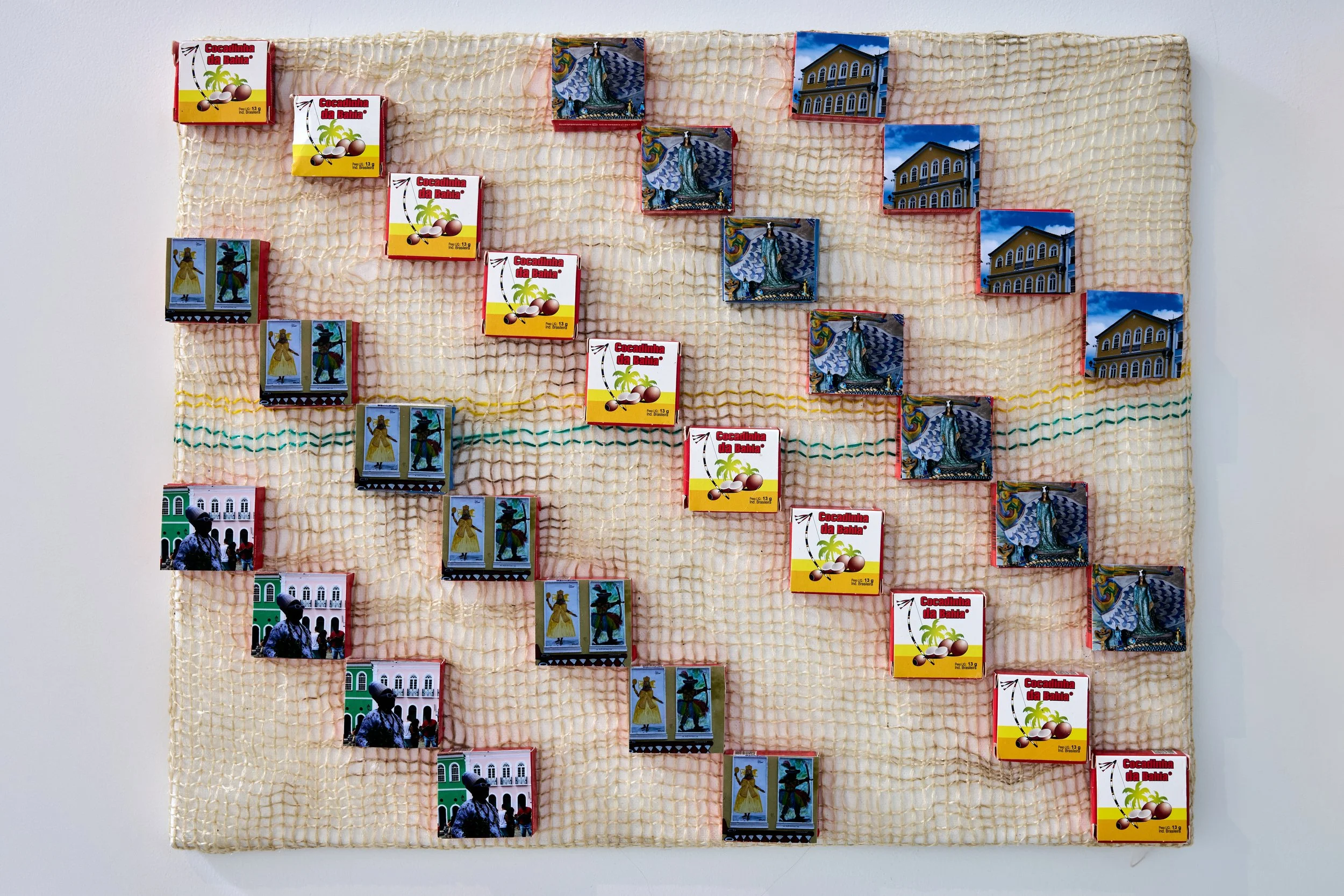 Doces (Sweets), 2026 Candy boxes, potato sack netting, and canvas 18 × 26 in.