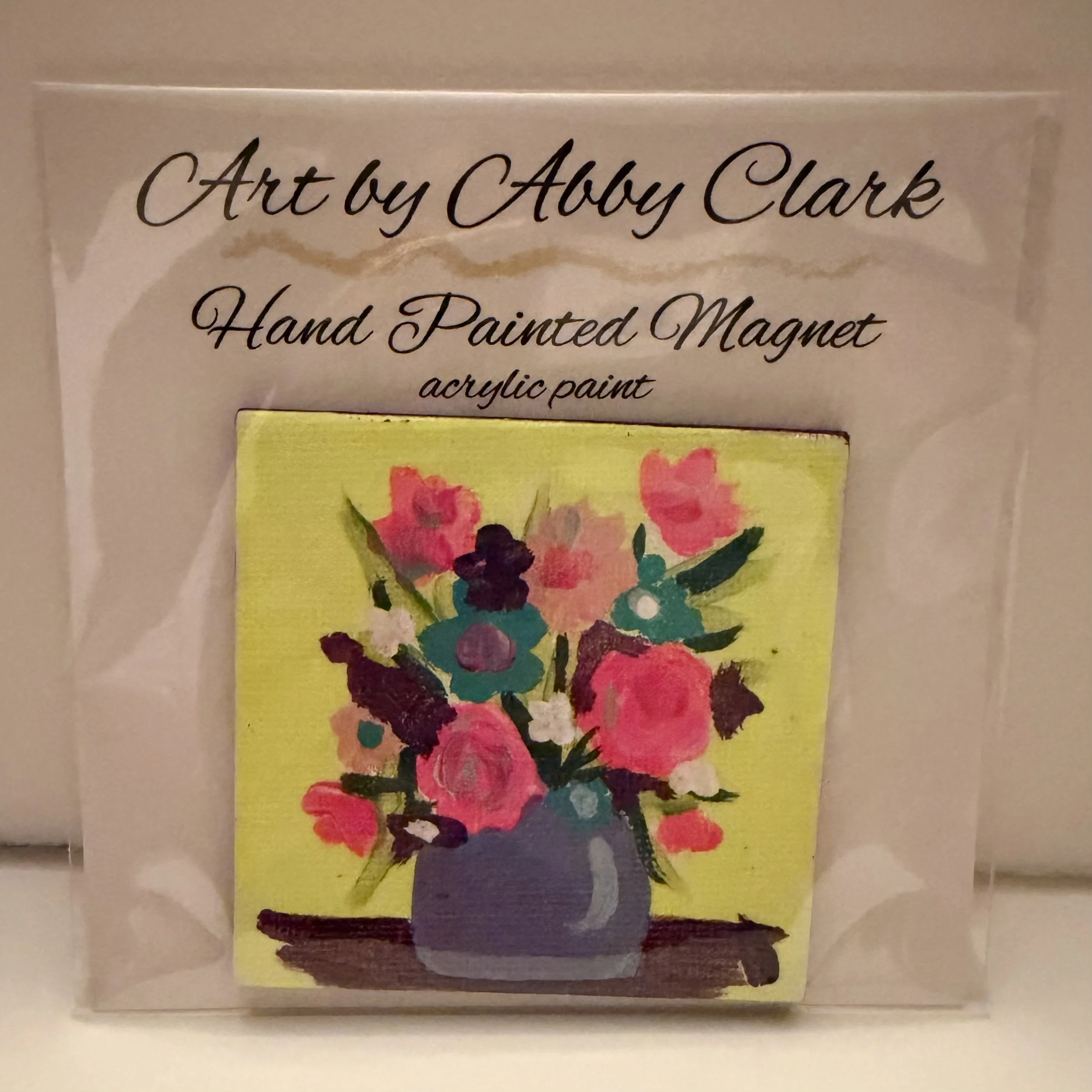 Bright Blooms hand-painted magnet by Abby Clark, with colorful flowers in a lavender vase on a yellow background