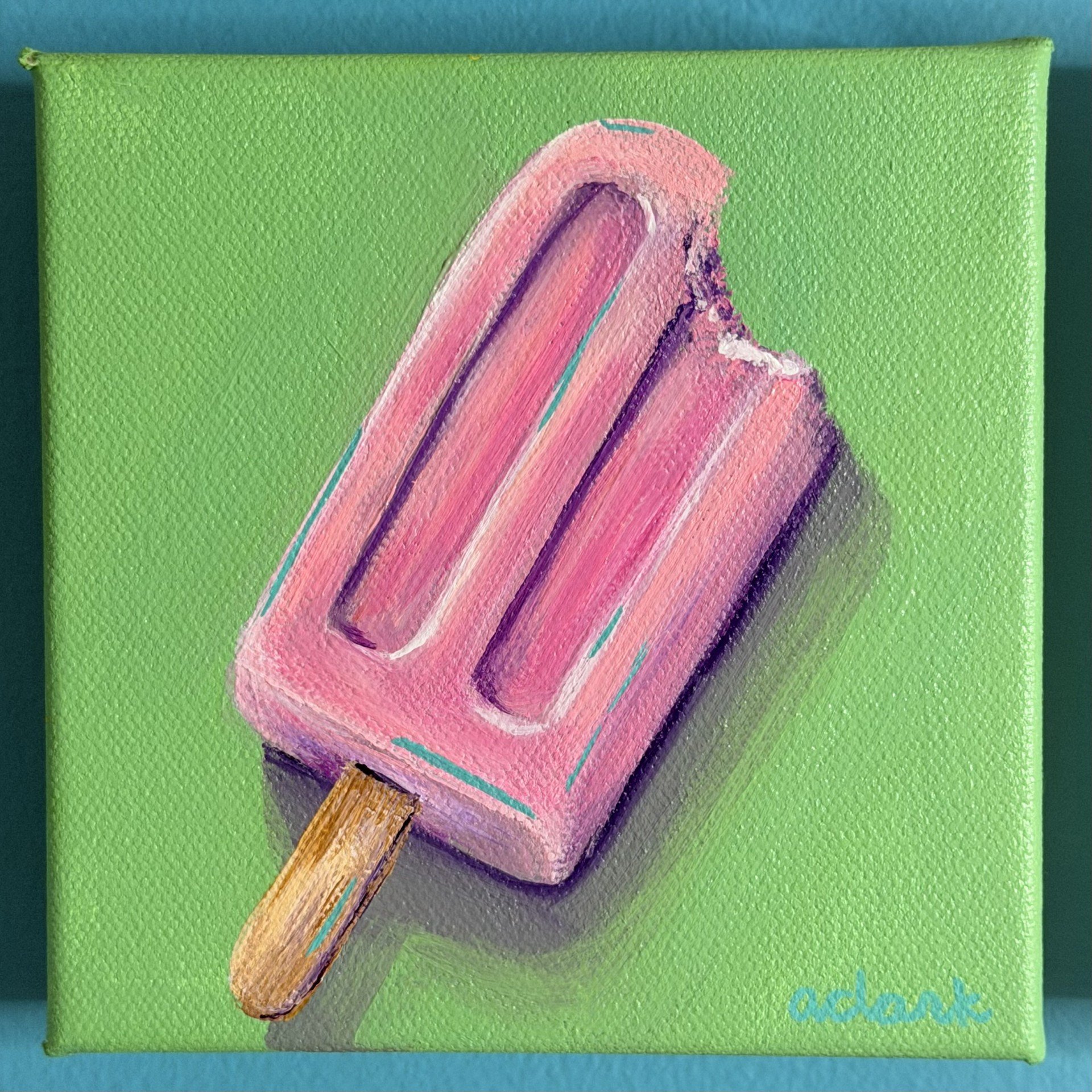 Pink popsicle mini painting by Abby Clark on a green background