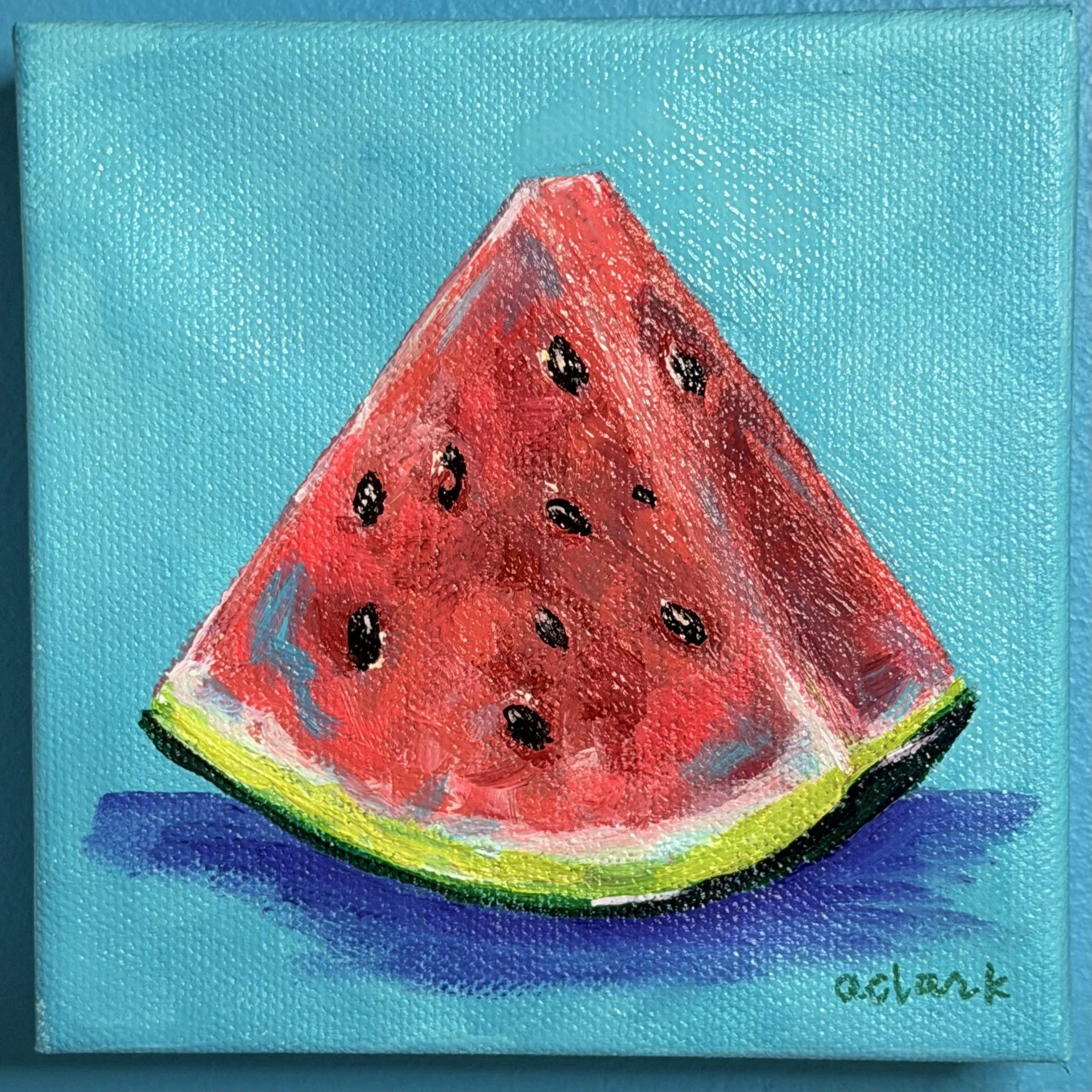 Watermelon slice mini painting by Abby Clark on a blue background