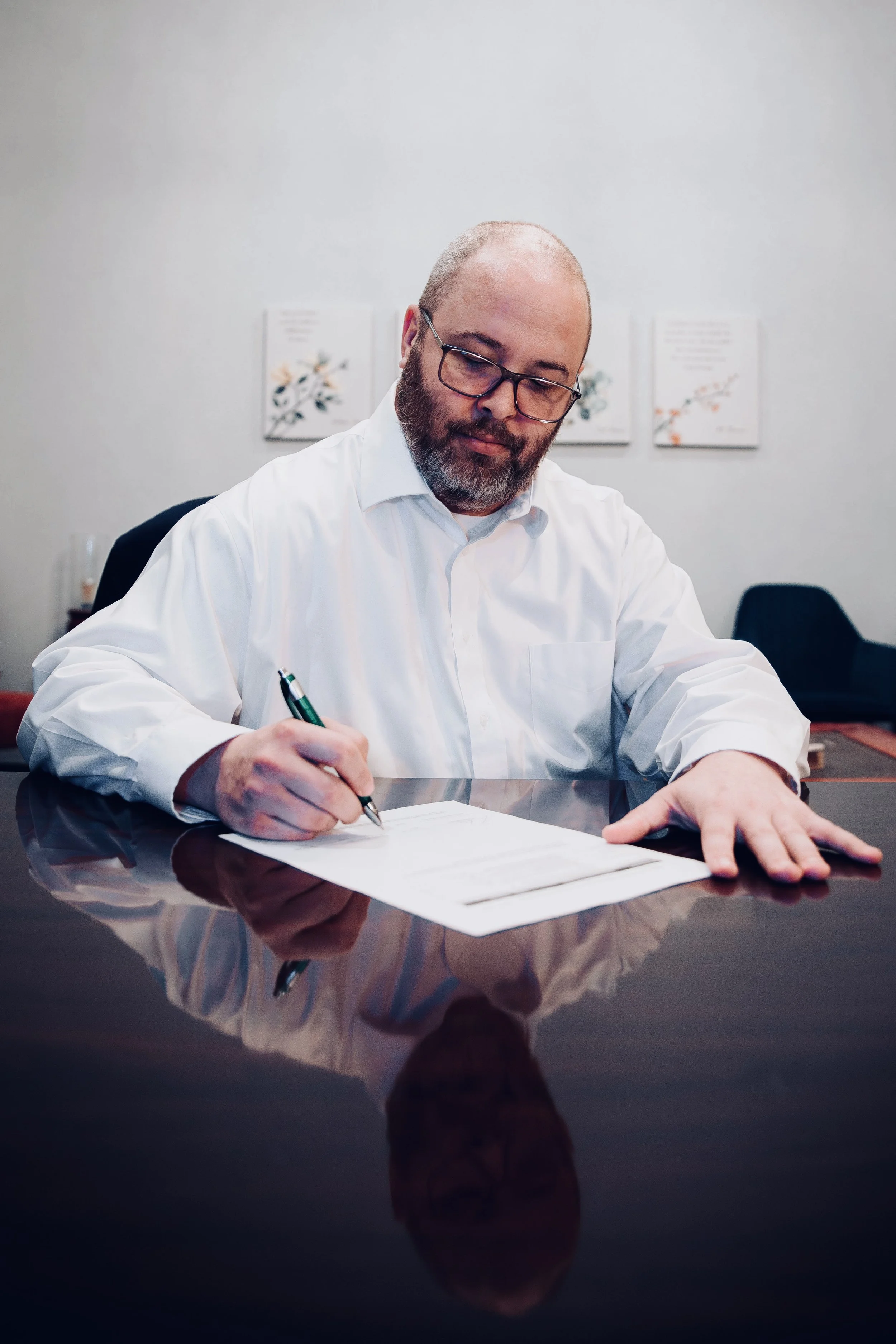 Jason Kreth, mental health attorney and owner of Mental Health Legal Solutions, reviews a legal document.