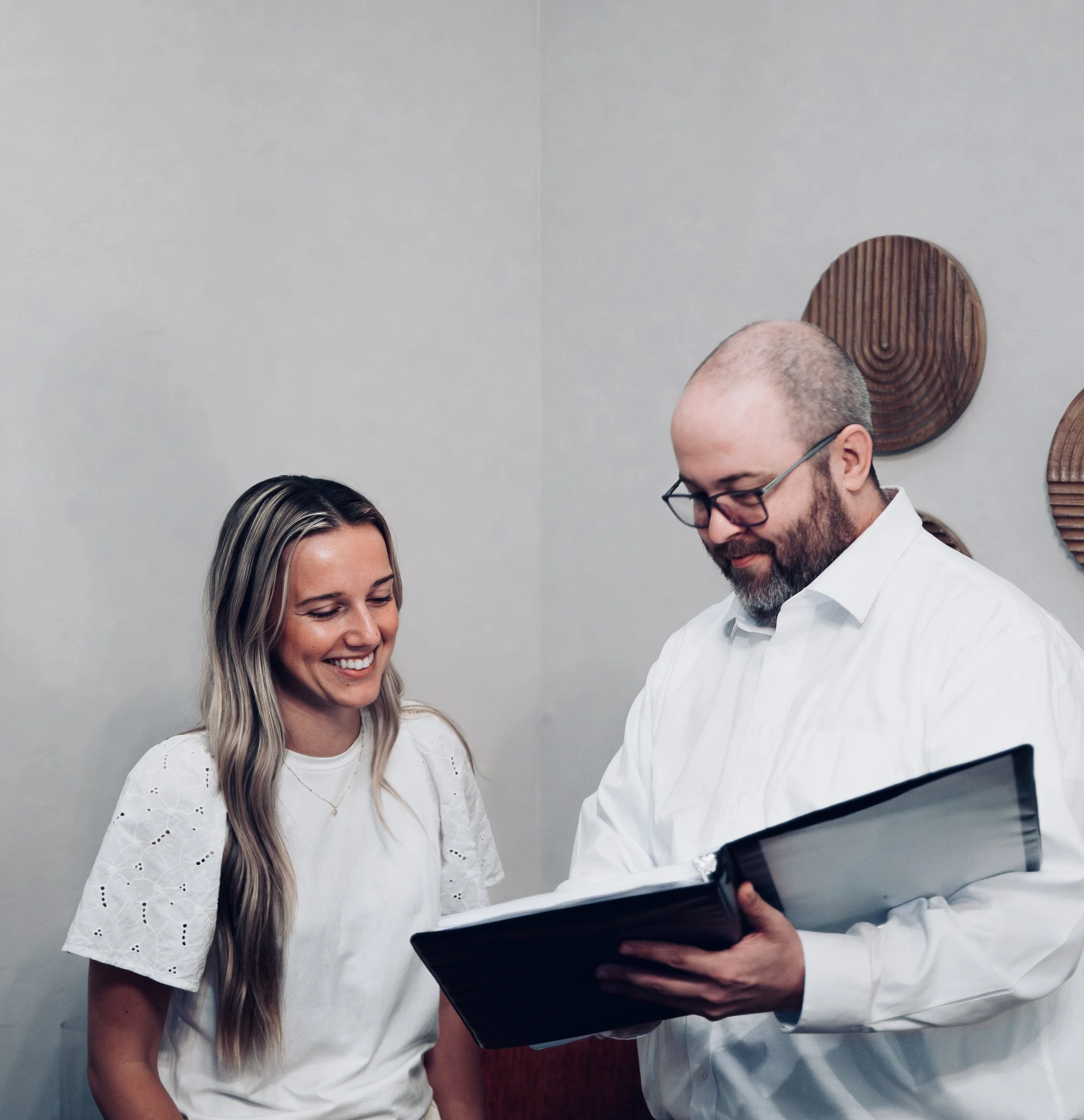 Oklahoma mental health attorney, Jason Kreth, shows a clinician client practice documents.