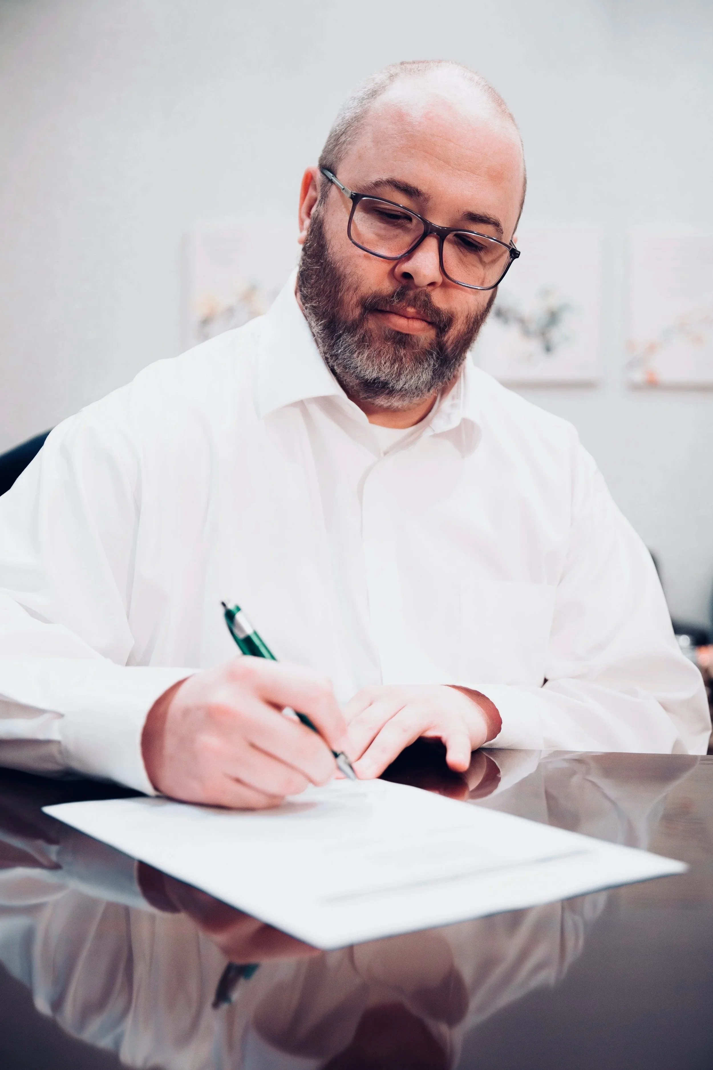 Oklahoma mental health attorney, Jason Kreth, reviews a legal document.