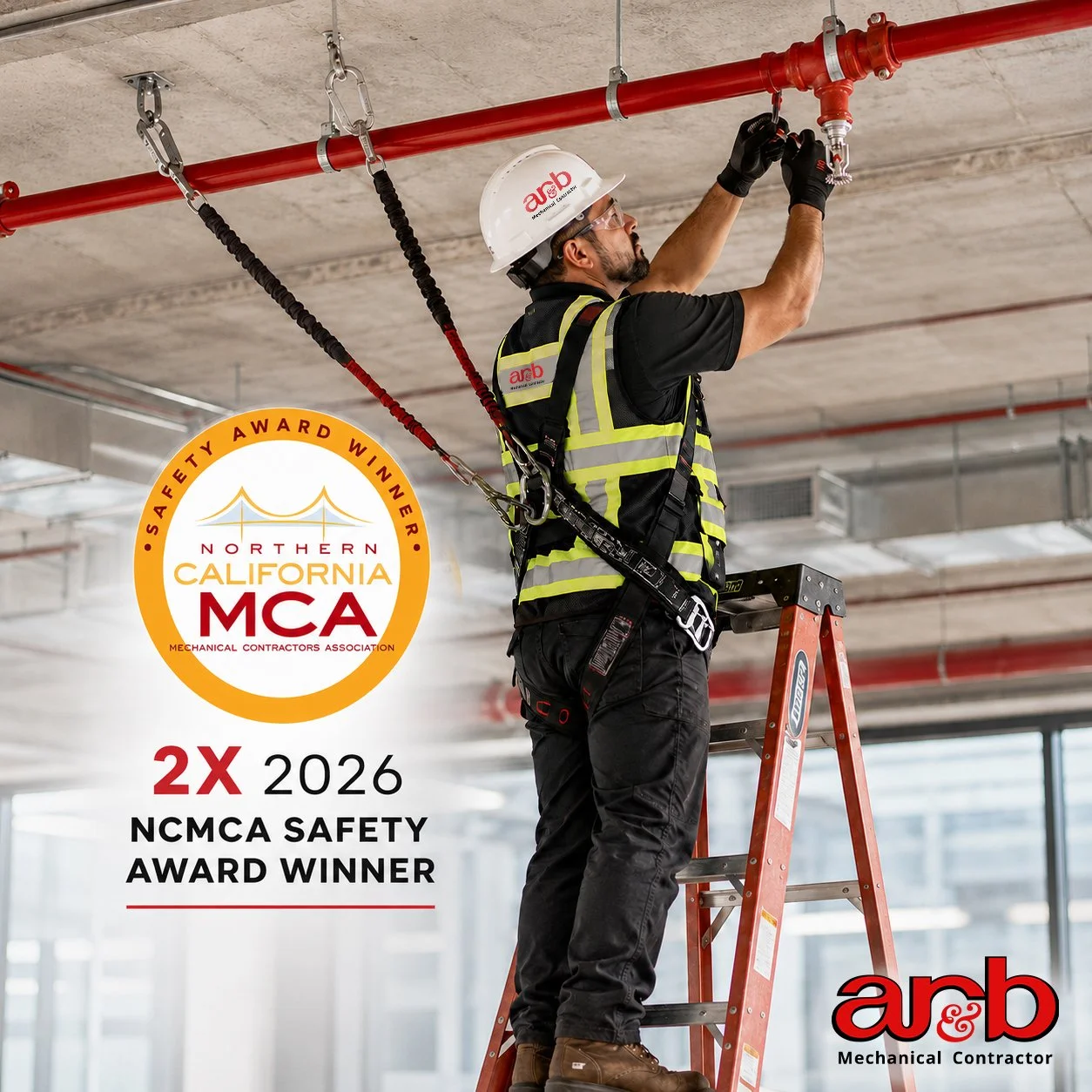 A construction worker on a ladder adjusting fire sprinkler pipes in a building under construction. The worker wears a safety helmet, safety glasses, gloves, a reflective safety vest, and a harness. The scene shows an industrial setting with an exposed concrete ceiling and red pipes. An award badge states: 'Northern California MCA 2X 2026 NCMA Safety Award Winner.' AR&B logo with the tagline 'Safe. Reliable. Built Right.' is also visible.