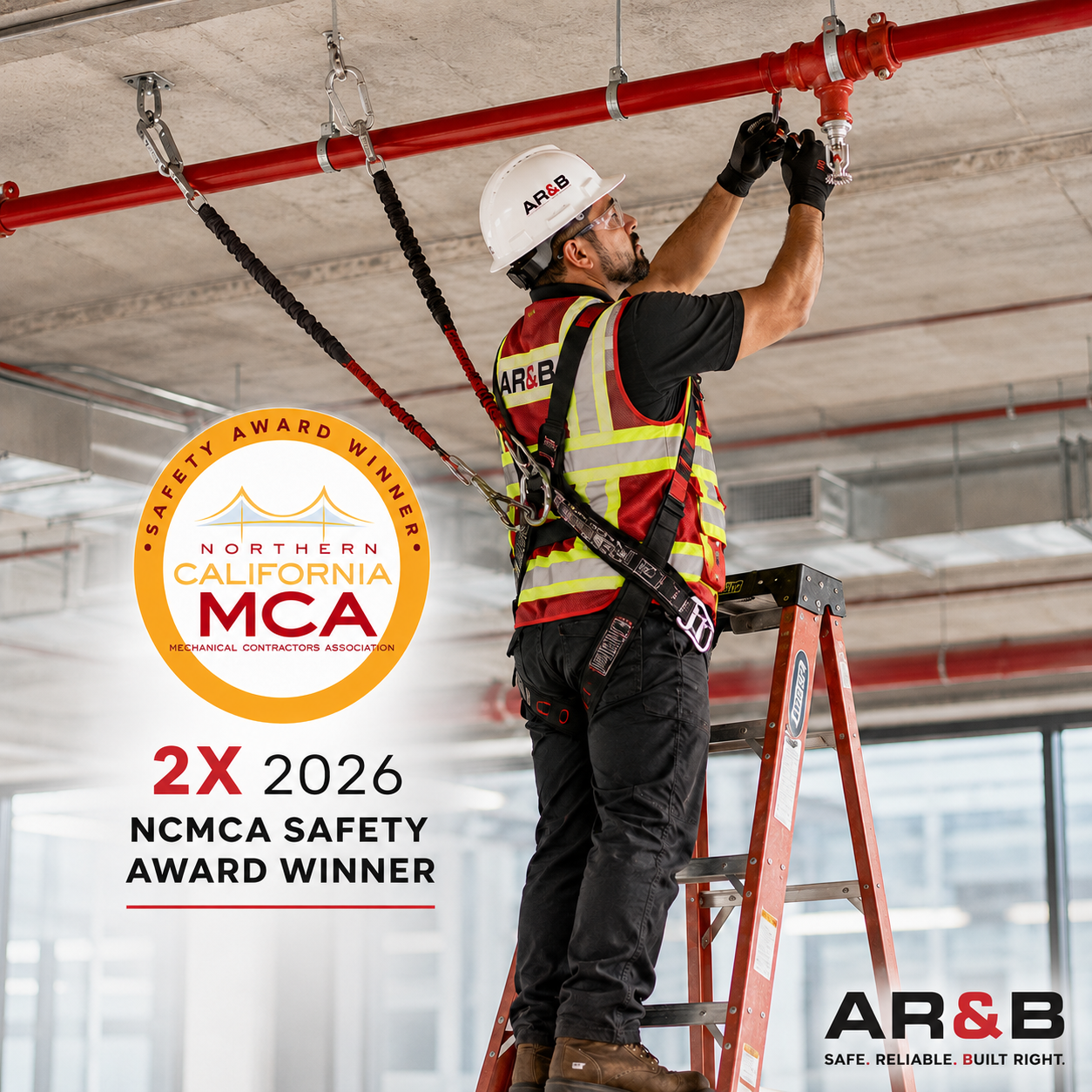 A construction worker on a ladder adjusting fire sprinkler pipes in a building under construction. The worker wears a safety helmet, safety glasses, gloves, a reflective safety vest, and a harness. The scene shows an industrial setting with an exposed concrete ceiling and red pipes. An award badge states: 'Northern California MCA 2X 2026 NCMA Safety Award Winner.' AR&B logo with the tagline 'Safe. Reliable. Built Right.' is also visible.