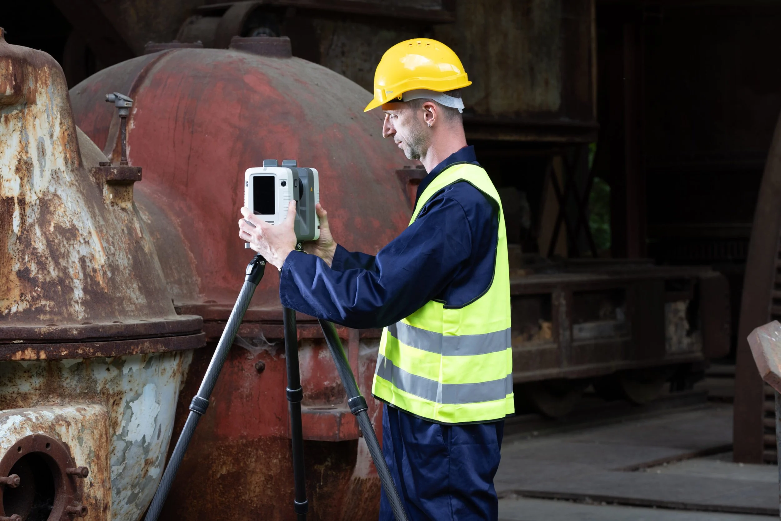A worker scanning tanks with the Artec Ray II LiDAR scanner