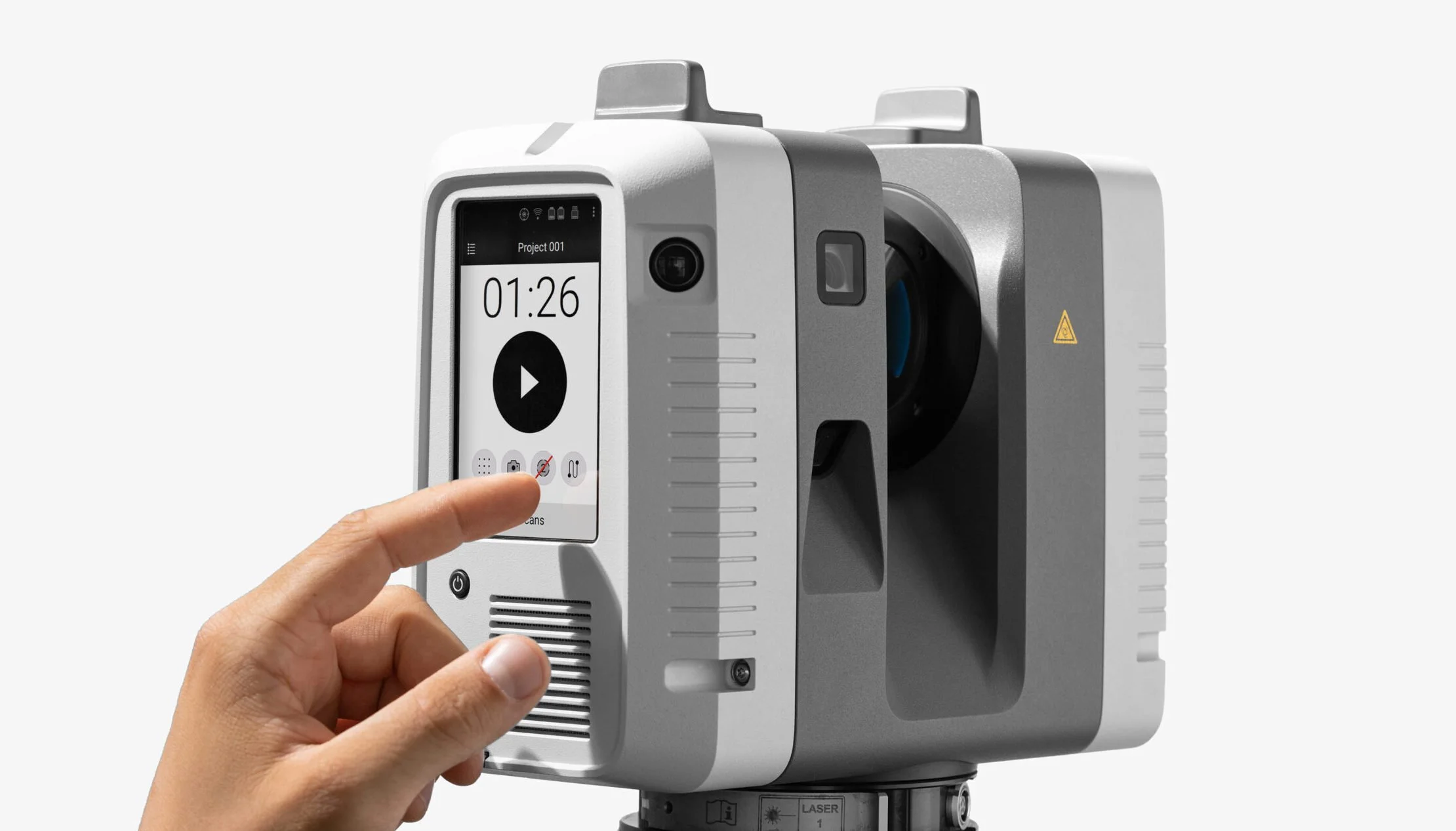 A person pressing buttons on a modern laser measurement device with a digital display showing a timer. The device is gray and white with multiple icons and a camera lens.