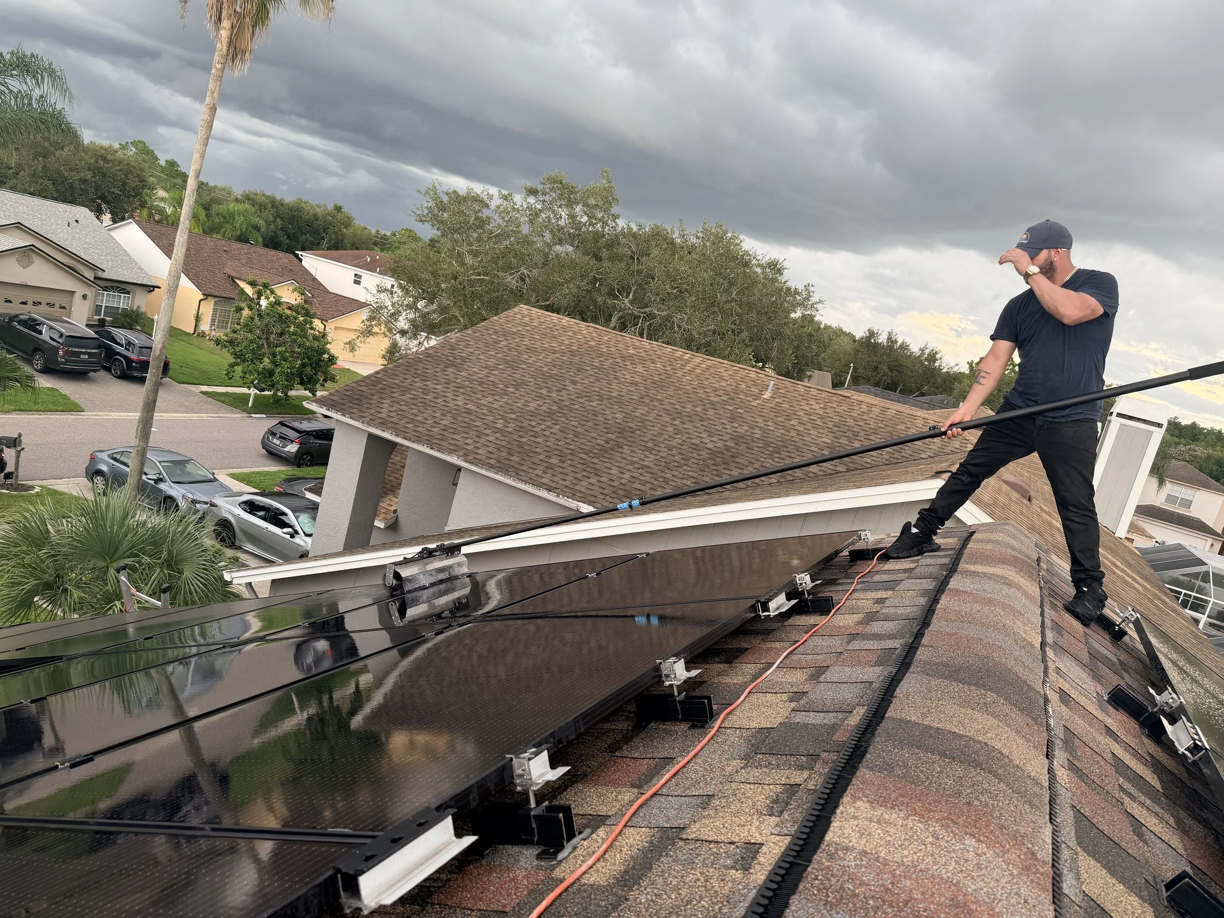 Professional rotary brush removing accumulated dirt from solar panels
