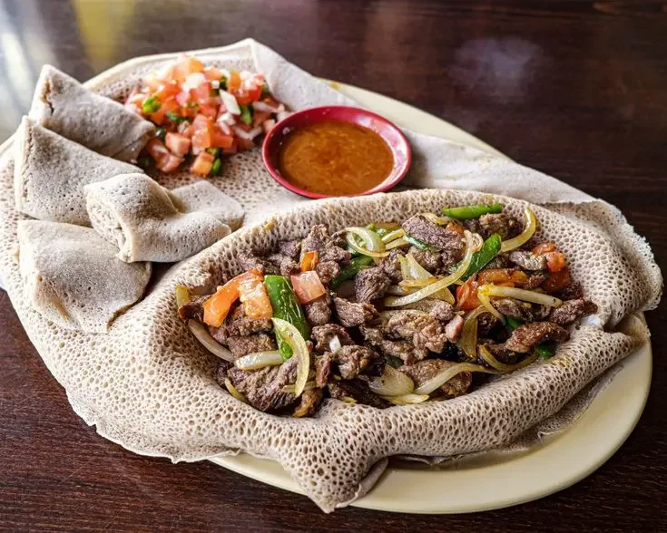 Ethiopian Beef Tibs w_ tomatos and spicy dipping sauce #food #meal #foods #healthyfood #keto.webp