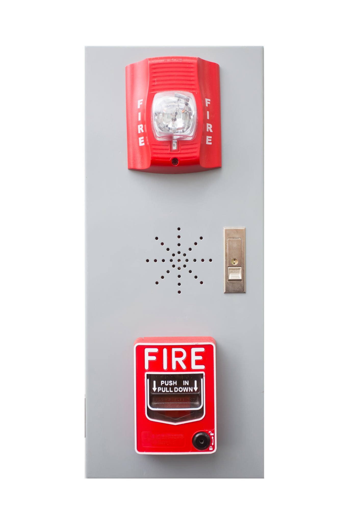 Red fire alarm pull station with a safety light above it, mounted on a gray wall, with an emergency off switch and a 'FIRE' sign below.