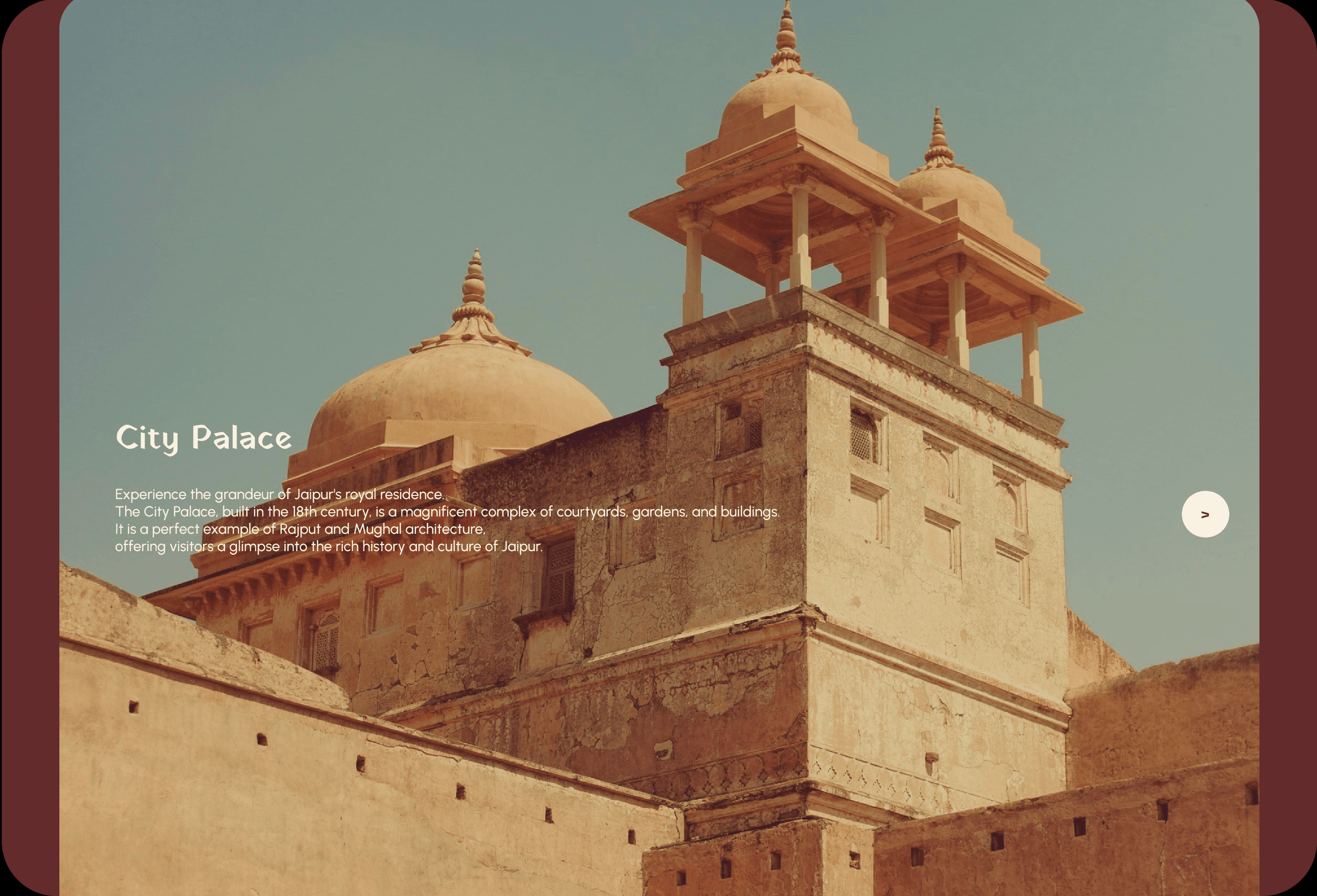 The image features a historic sandstone building with domed pavilions and a tower, likely part of Jaipur's City Palace, against a clear blue sky.