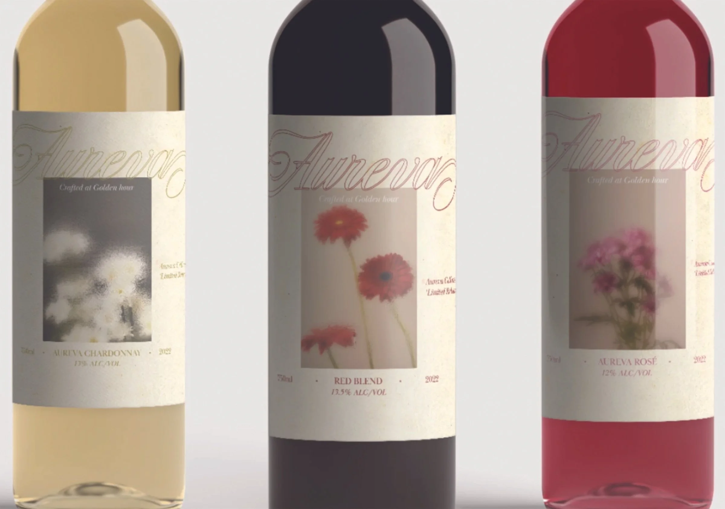 Three bottles of wine with labels that read 'Aurevoir,' 'Red Blend,' and 'Aurevoir Rosé' from left to right. The bottles contain wine of different colors: white, red, and rosé.