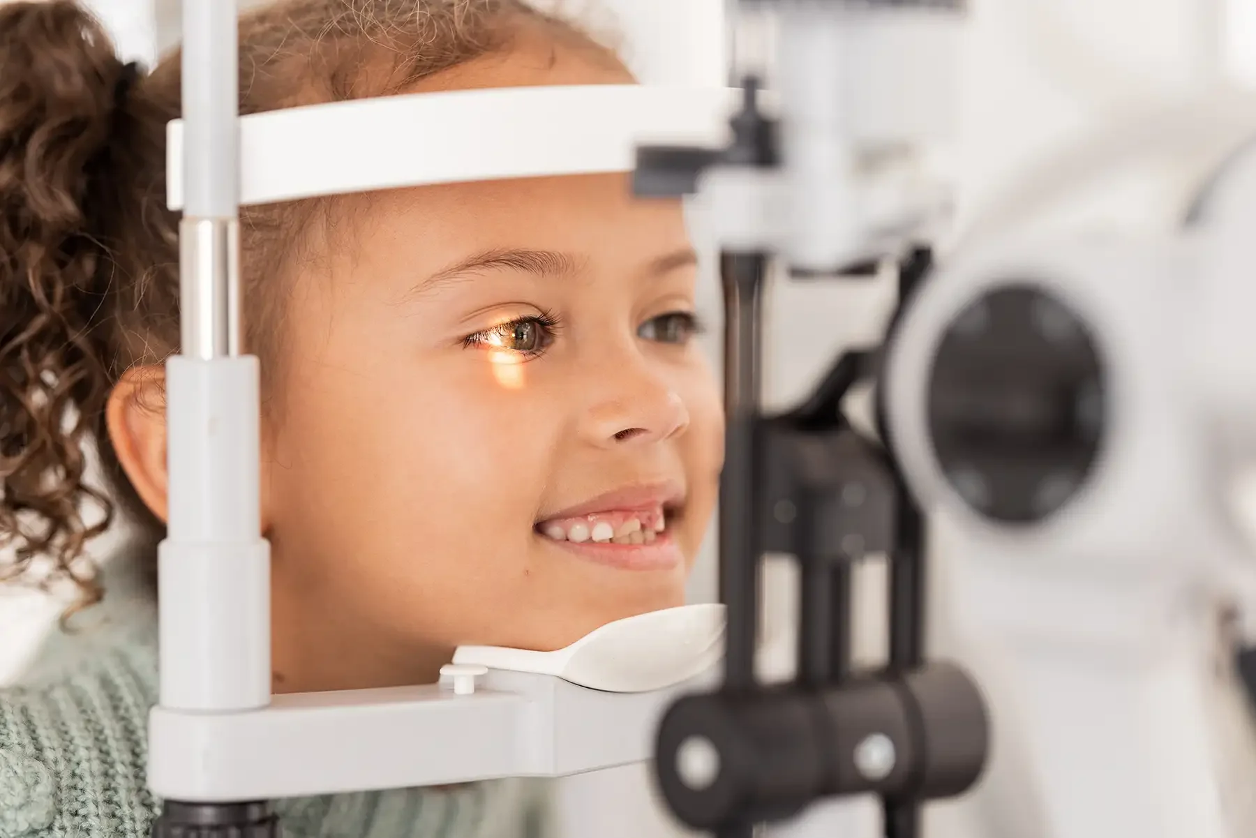 young girl getting her eyes tested