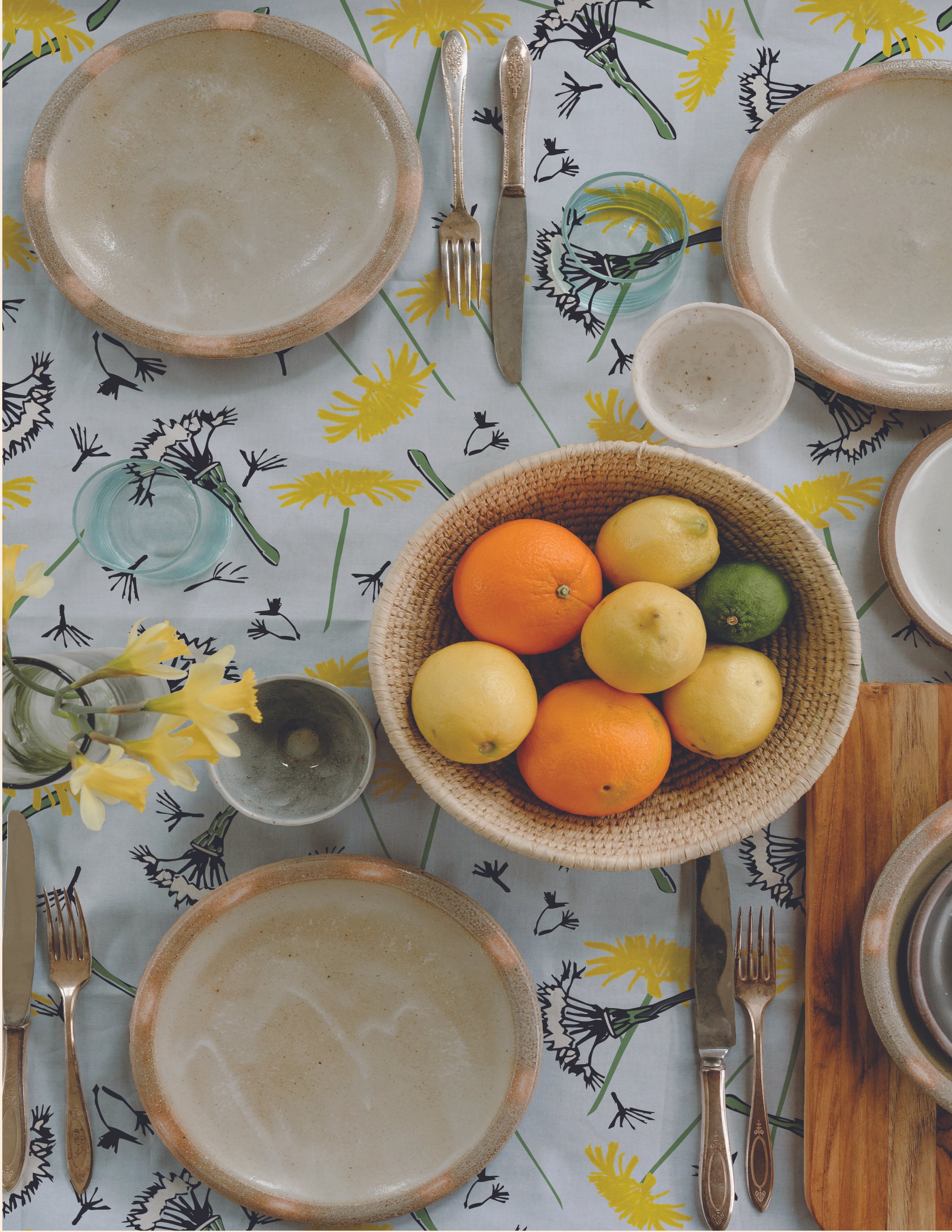 A patterned tablecloth with Dancing     Dandelions as a fabric.