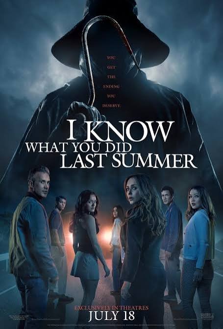 Poster for the movie "I Know What You Did Last Summer" featuring a hooded figure with a dark background, and a group of seven teens standing in front of it. The tagline reads "You get the ending you deserve" and the release date is July 18.