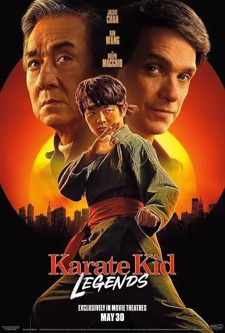 Movie poster for 'Karate Kid Legends' featuring Jackie Chan, Dane Wang, and Ralph Macchio with a city skyline and sunset in the background, promoting the movie's release on May 30.