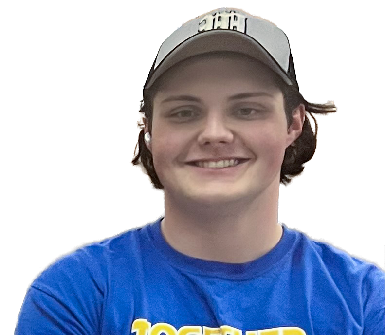Young man smiling, wearing a blue t-shirt and a baseball cap.