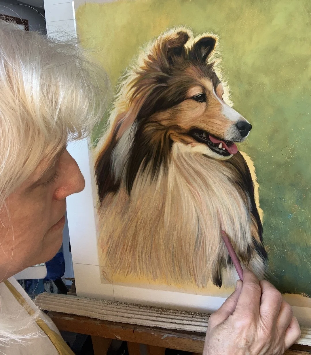 Artist painting a Sheltie in pastel