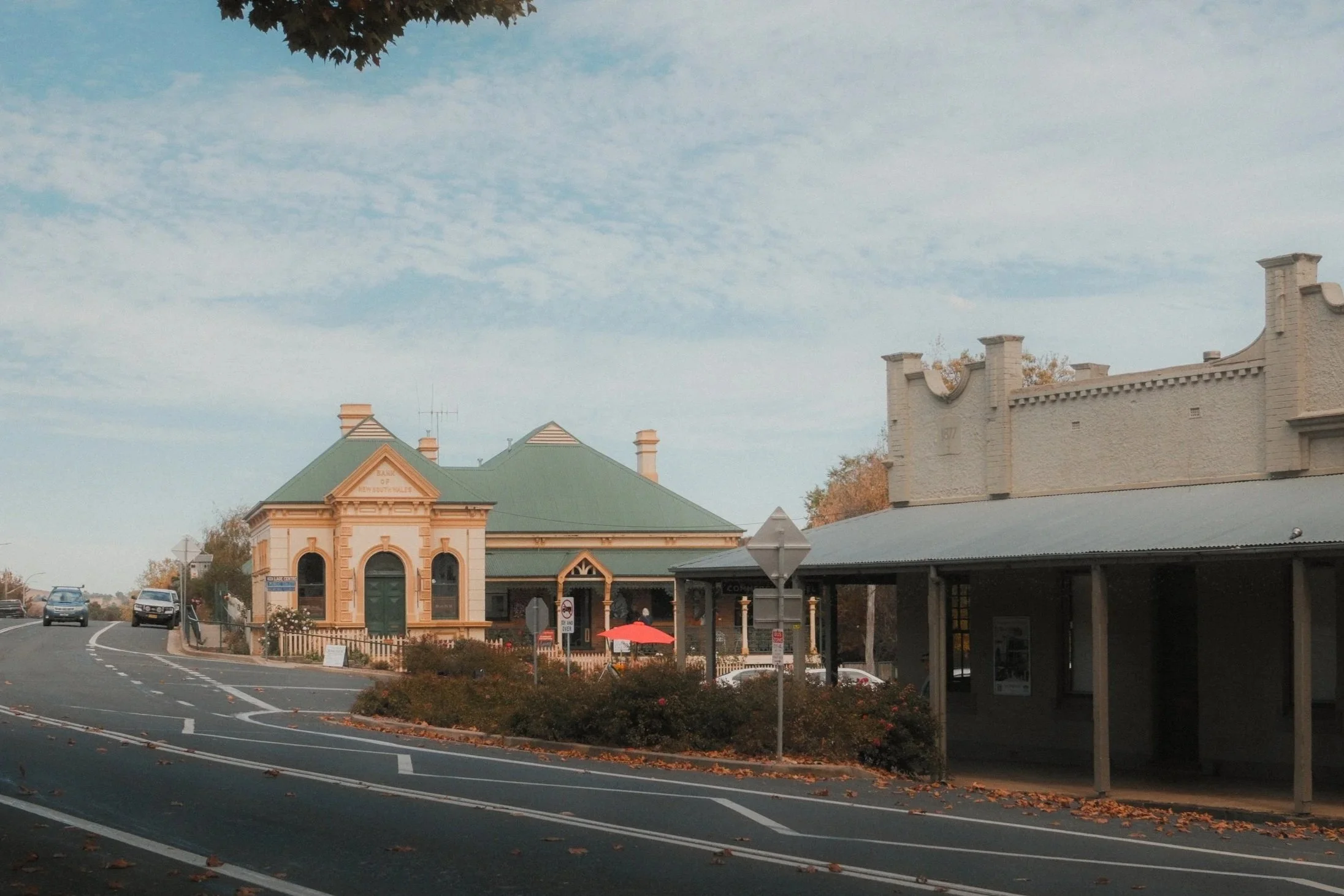 Millthorpe village street with heritage buildings, verandahs, autumn leaves and a quiet country road.