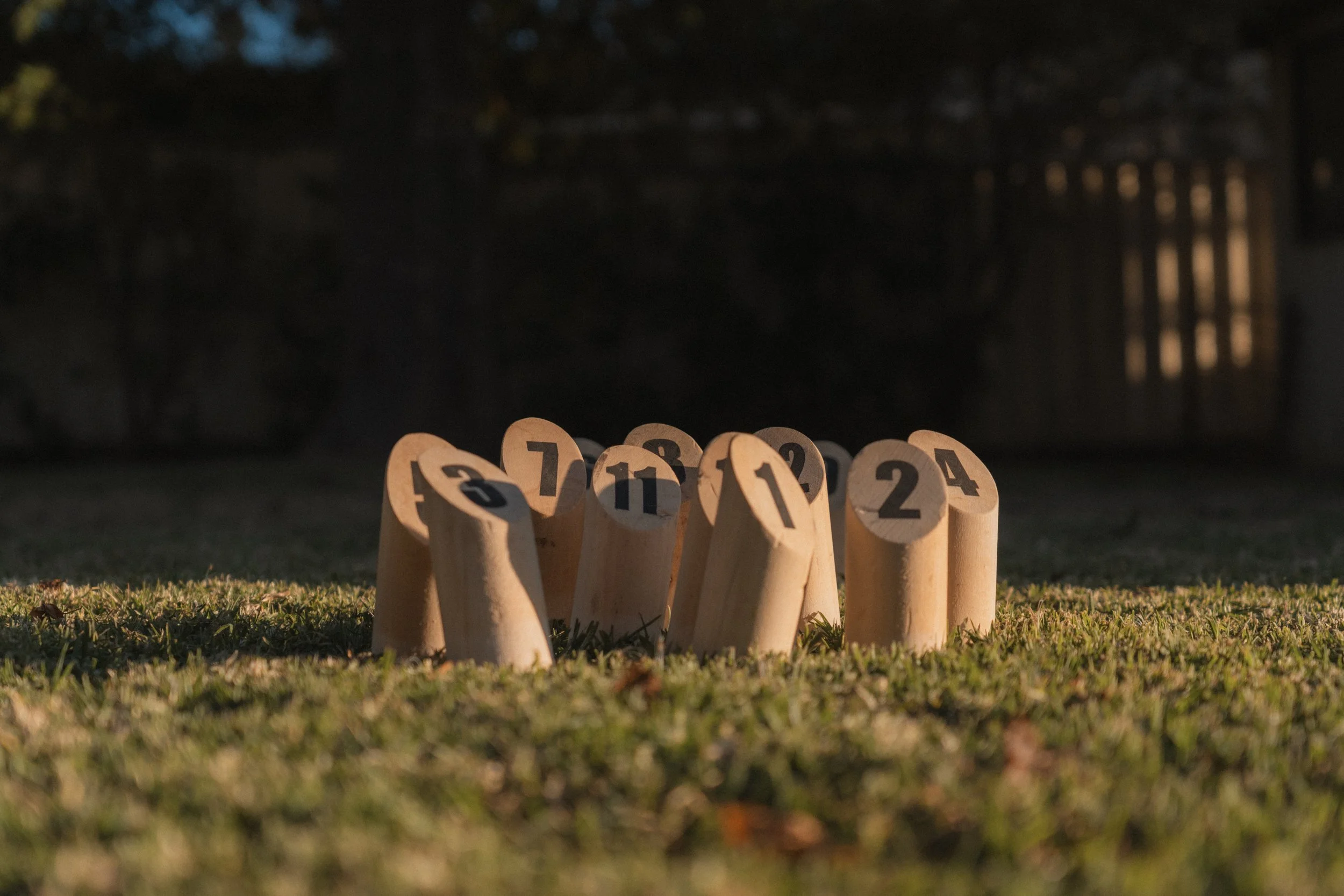 ooden lawn game pieces set up on the grass at Church Cottage Millthorpe in soft afternoon light.