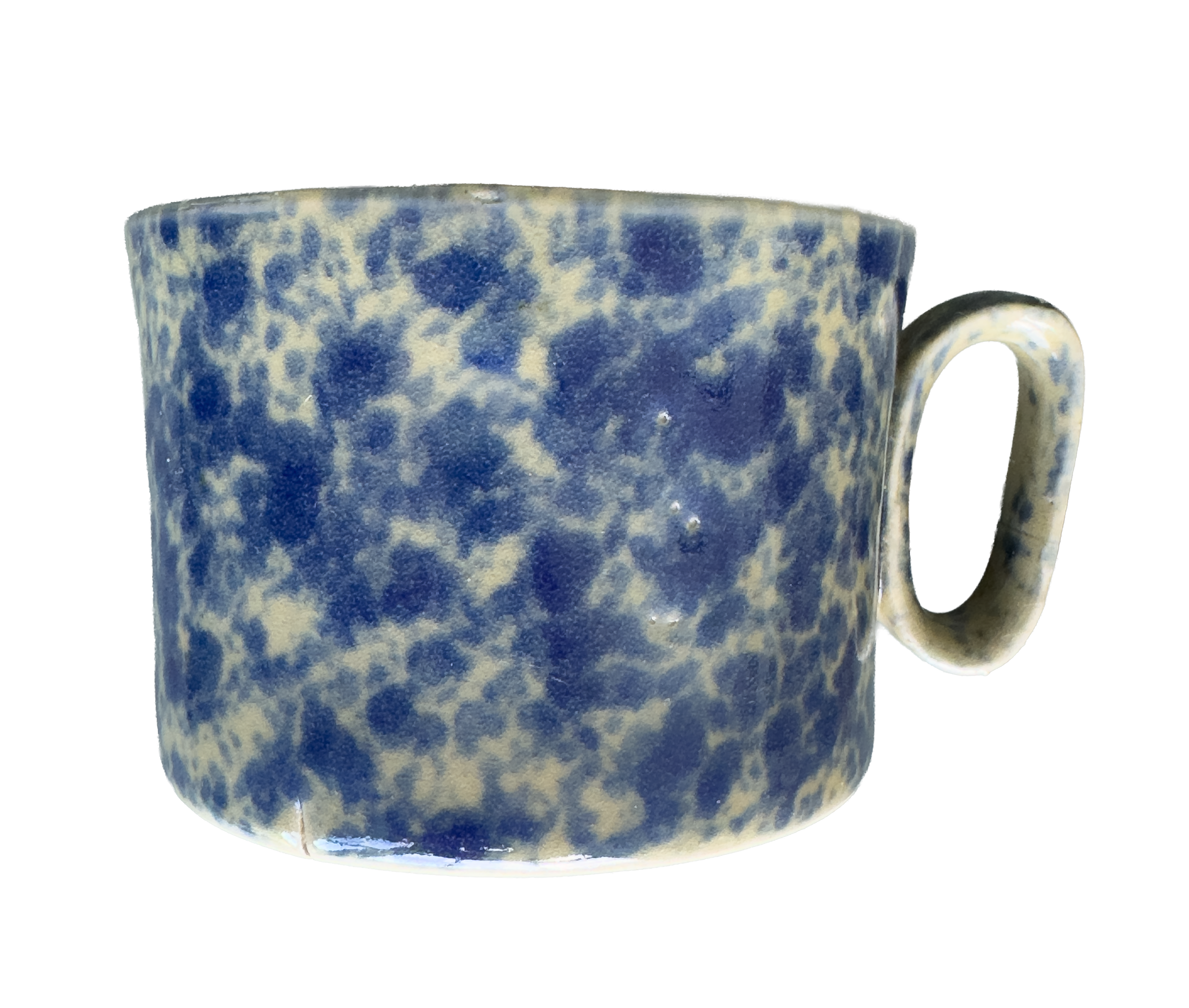 A ceramic mug with a blue and white speckled pattern, seen from the side with the handle visible.