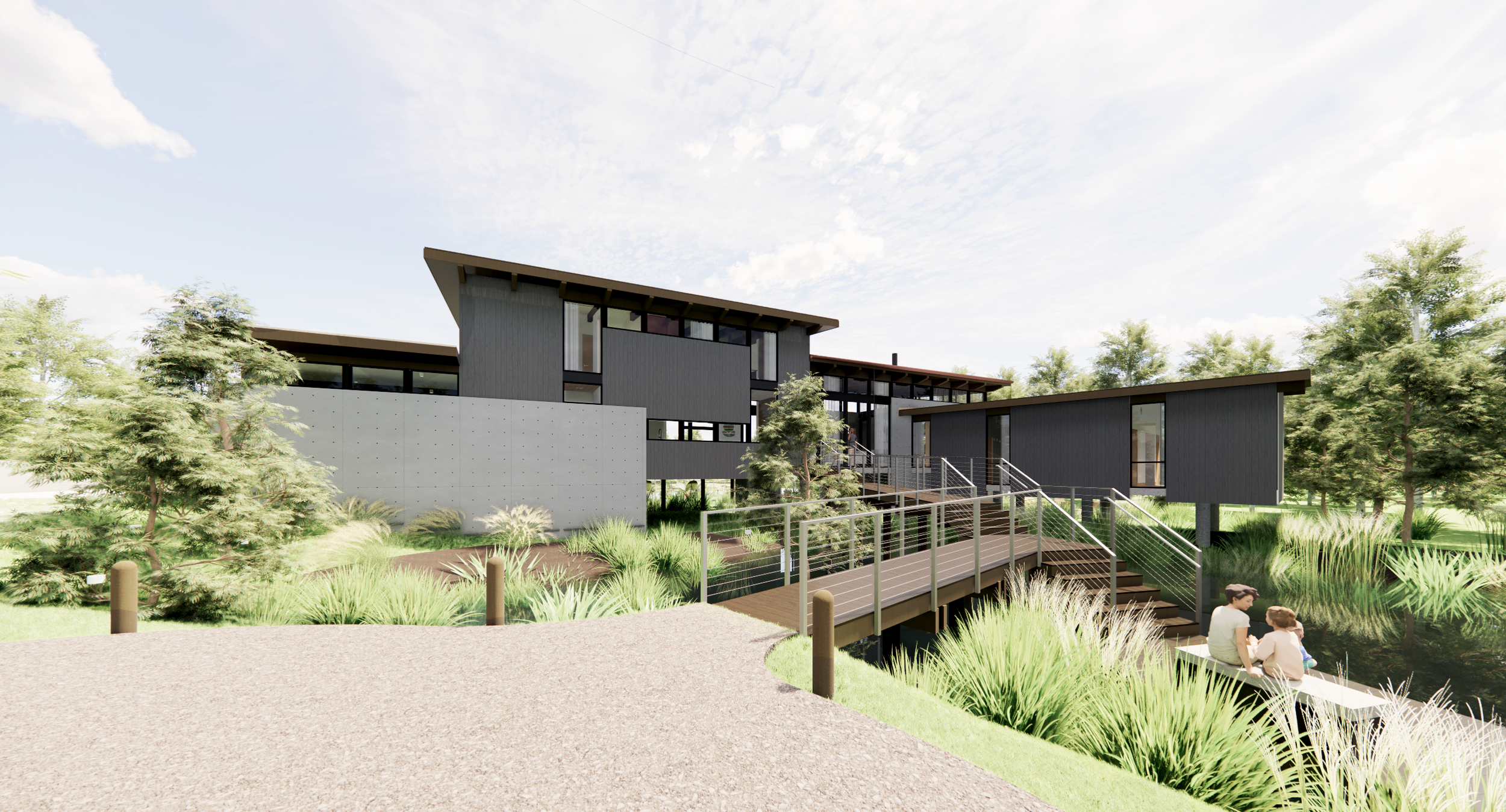 Modern house with dark gray exterior walls, large windows, and a complex roof design, surrounded by lush greenery and a pathway with a railing, with two children sitting on the grass.