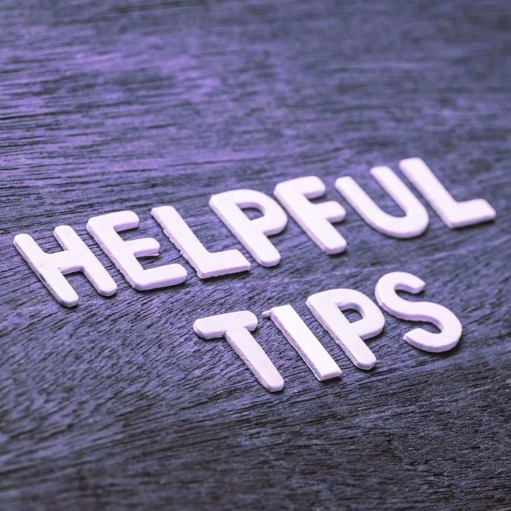 White letters spelling 'HELPFUL TIPS' on a wooden surface.