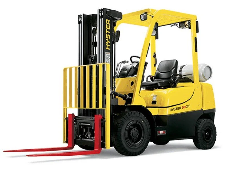 Yellow Hyster forklift with red forks and safety gate
