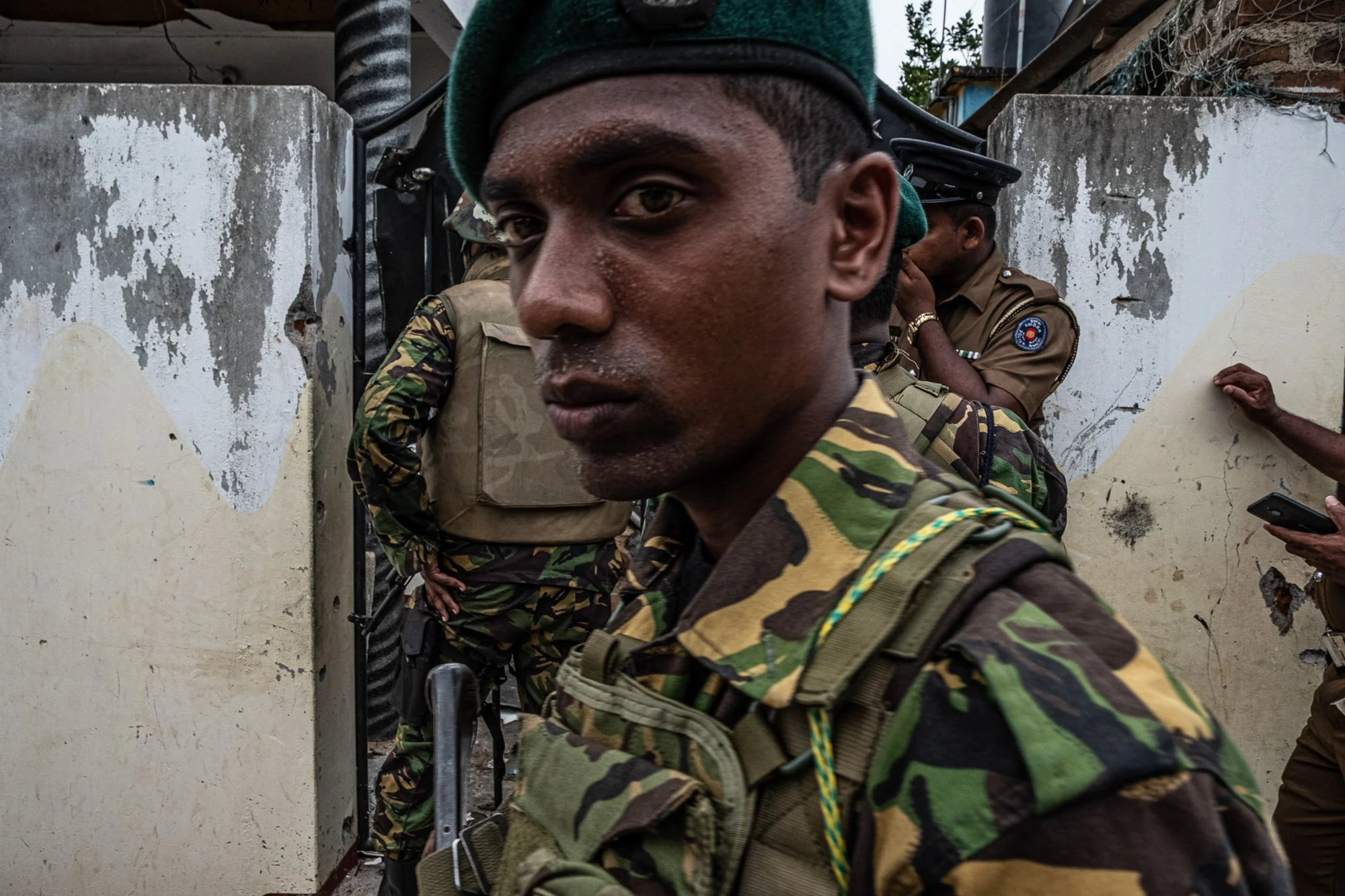 Sri Lankan army personnel stand outside a rented home in Sainthamaruthu after a raid on a suspected hideout.