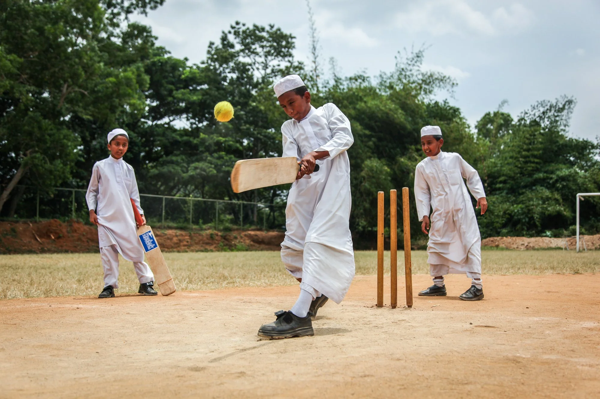 Muslim boys play cricket at a park in Kandy, Sri Lanka.