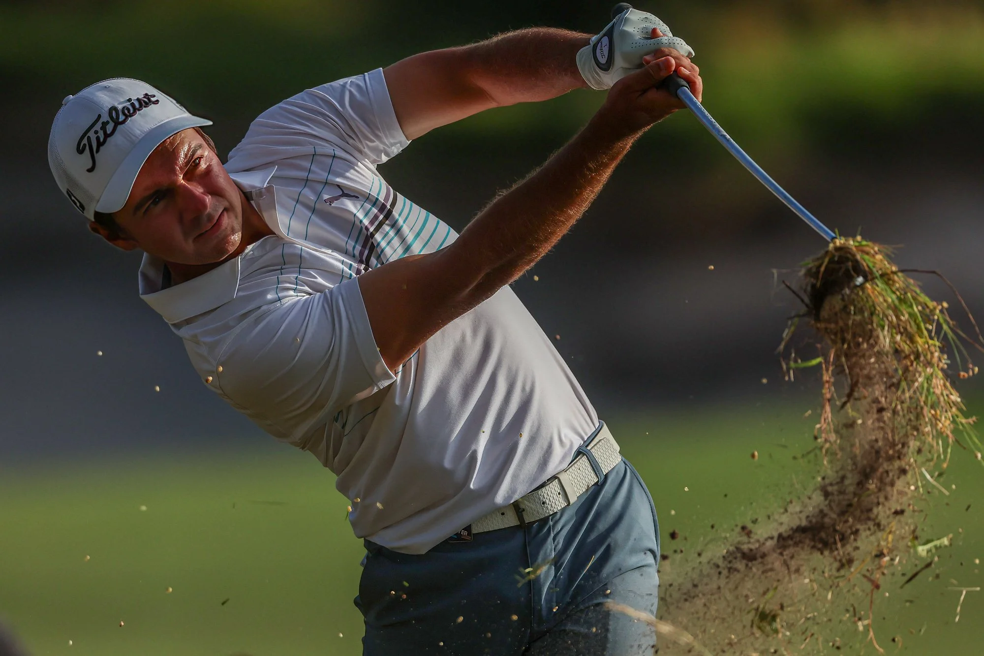 David Micheluzzi plays out of the rough during the final round of The Australian Open on the 18th Hole at Victoria Golf Club