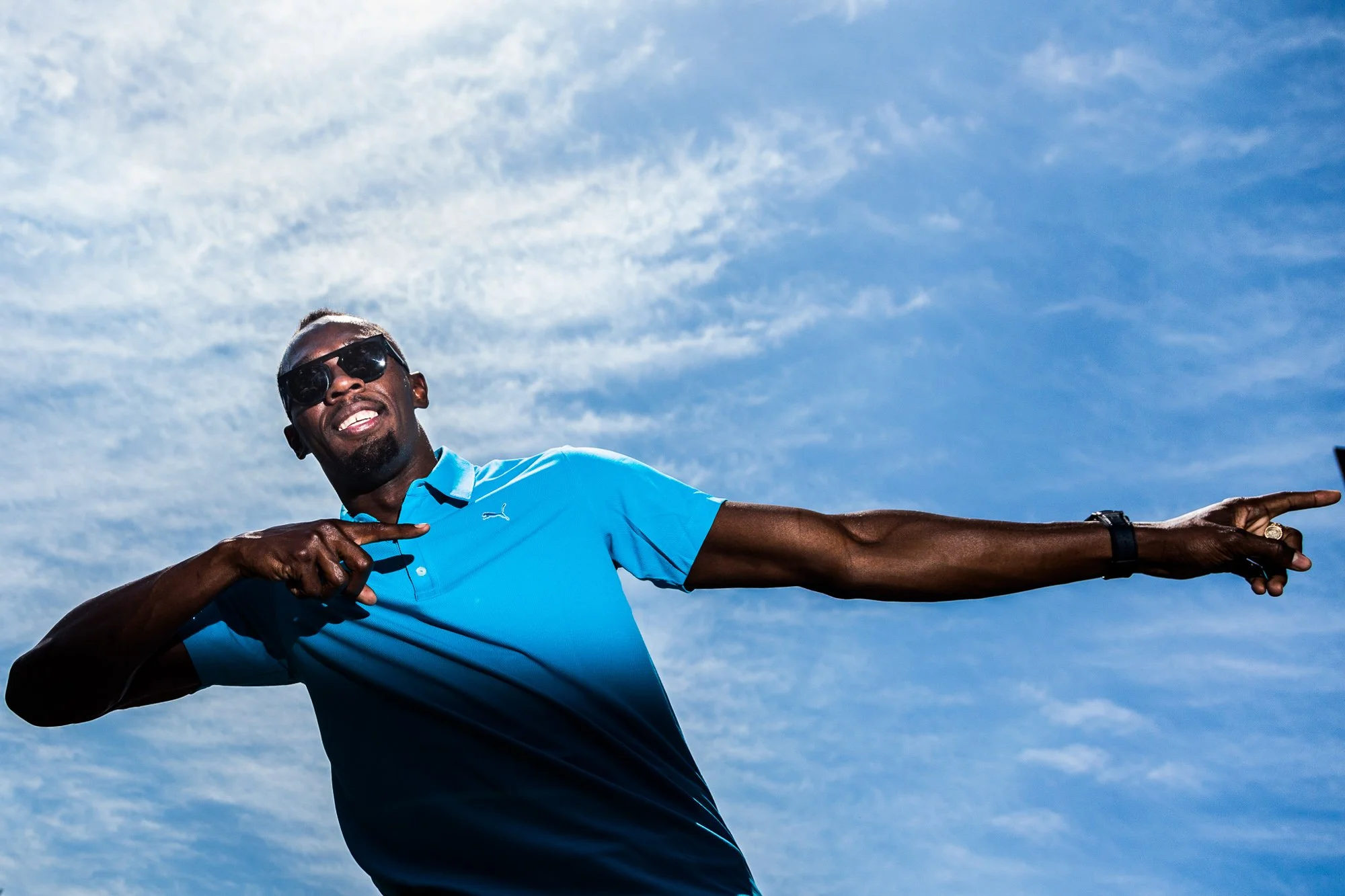 Usain Bolt doing his iconic pose during the launch of the Nitro Athletics
