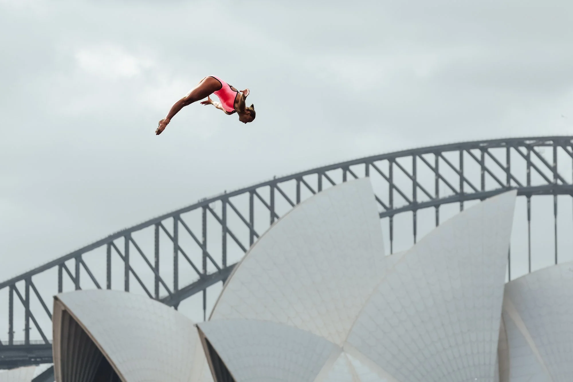 Elisa Cosetti diving in front of the Sydney Opera House & Harbour bridge during the Cliff Diving World Series championship in Sydney, Australia, November 10, 2024. Photo by Asanka Brendon Ratnayake