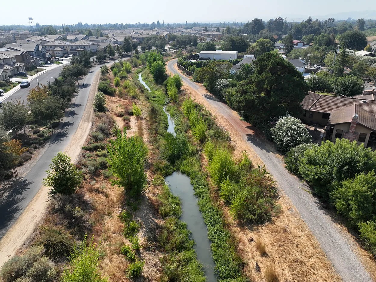 Aerial view of the restored creek channel at Three Creeks Parkway