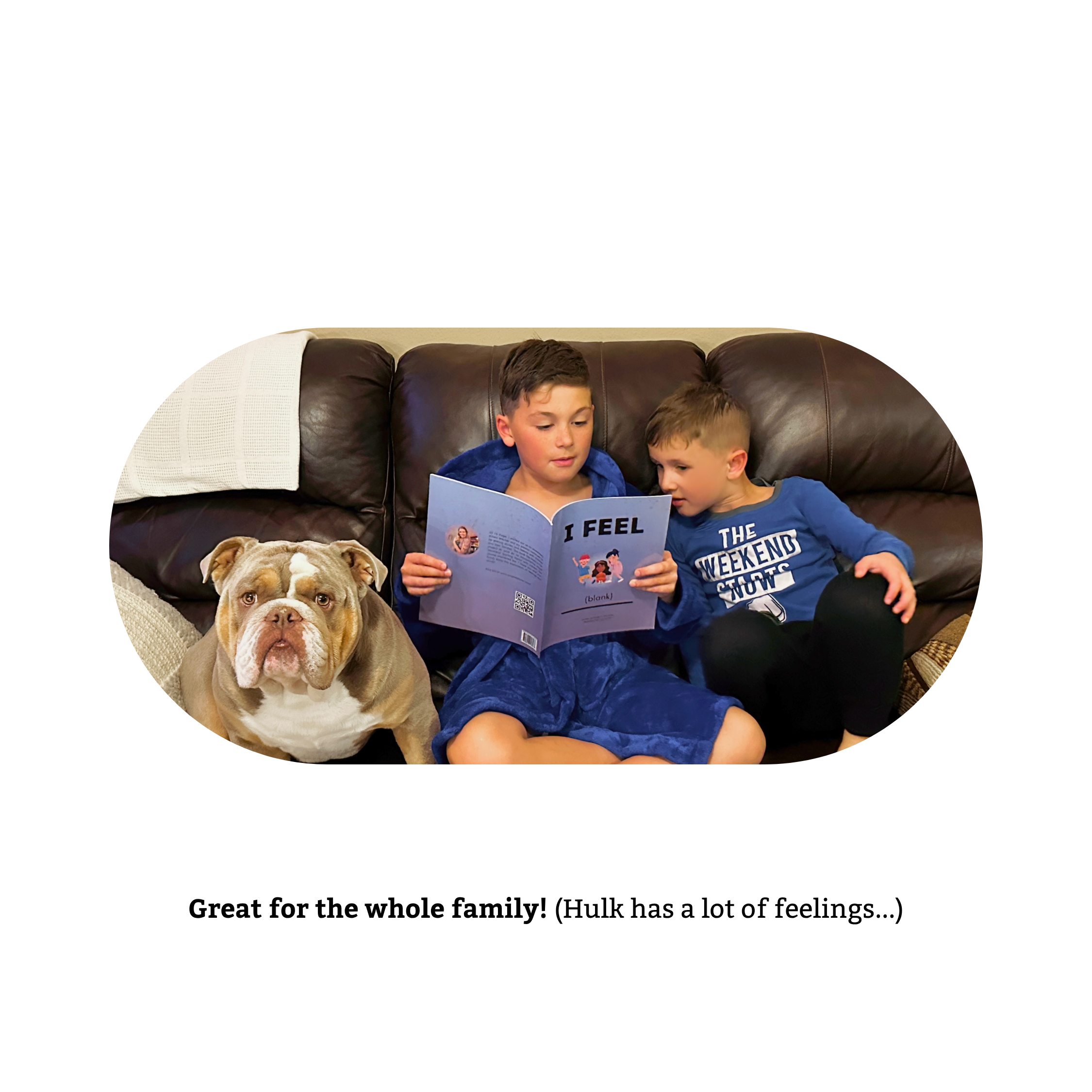 Two young boys sitting on a brown leather couch, reading a colorful book titled 'I Feel (blank) with a message on the cover about feelings, while a bulldog lies with them.