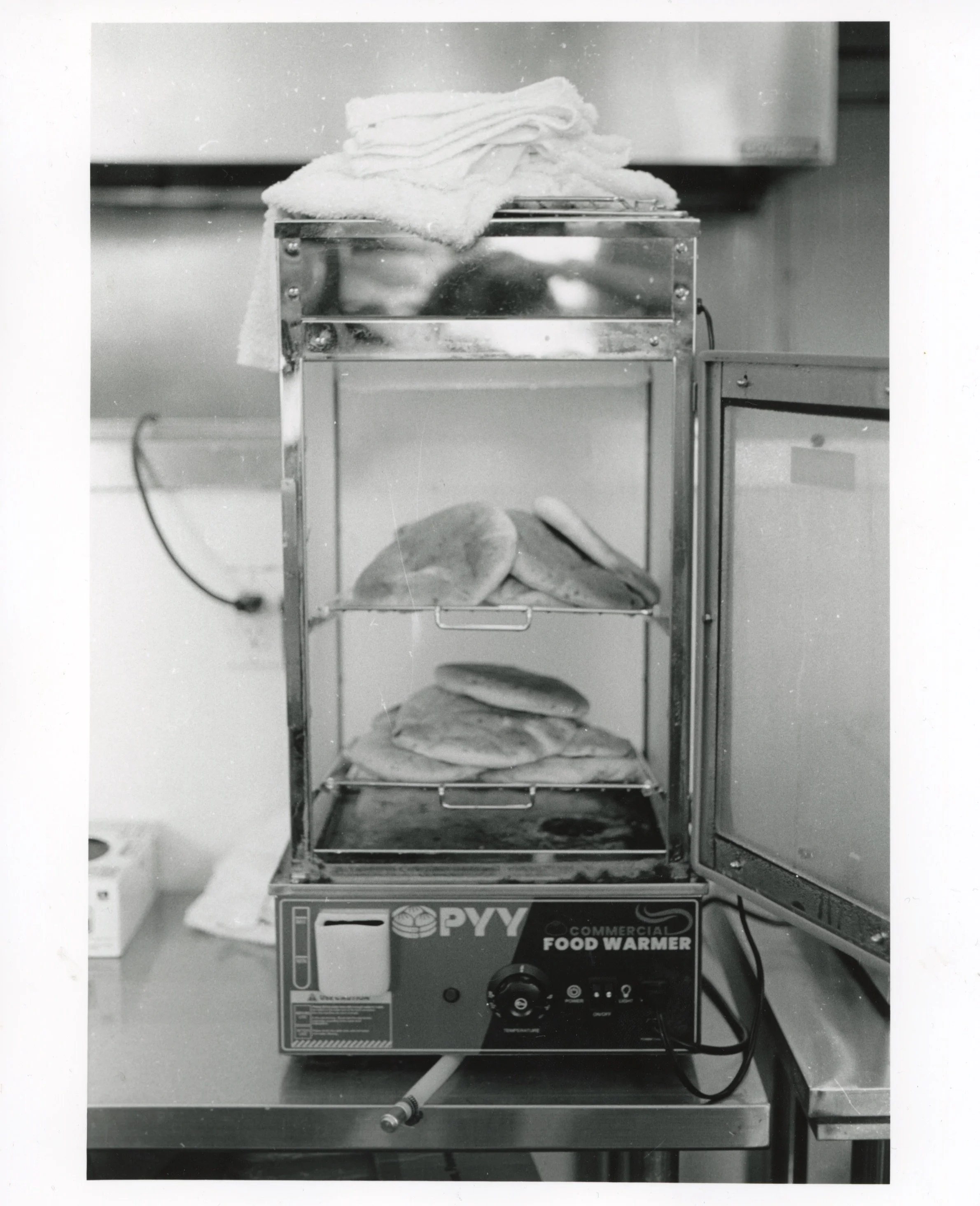 Pitas in a Steamer, 2026, Gelatin Silver Print from a B&W 35mm negative, 8” x 10”